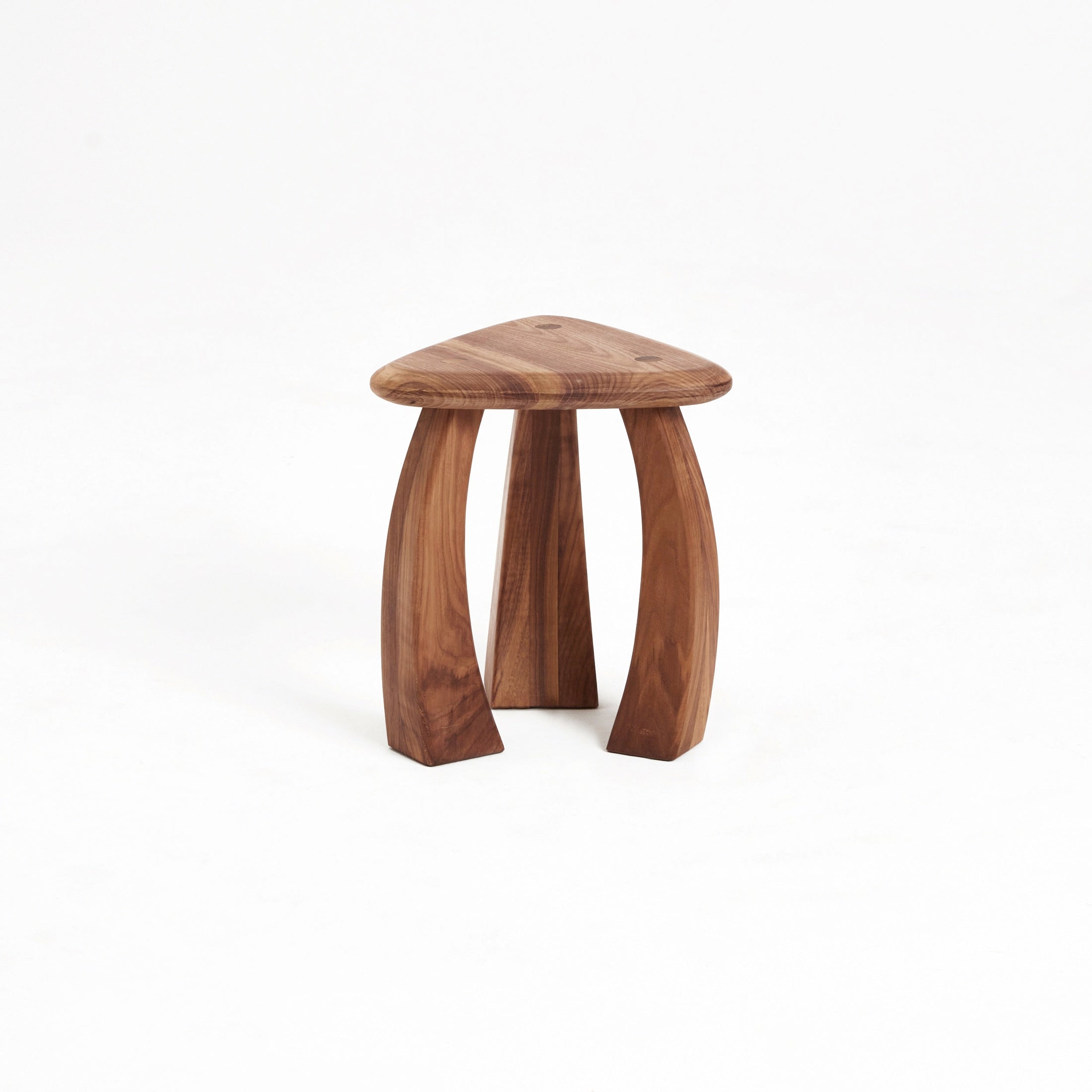 Arc de Stool '37 — side angle showing triangular wooden seat and legs