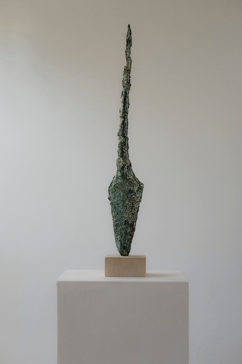 Bronze javelin sculpture by Clark Broadwood-Smith on white pedestal