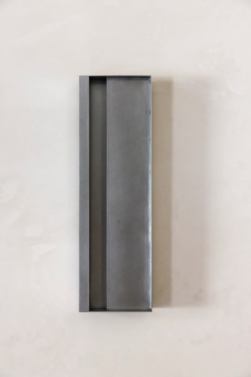 Julie Wall Lamp — close-up of matte gray metal surface