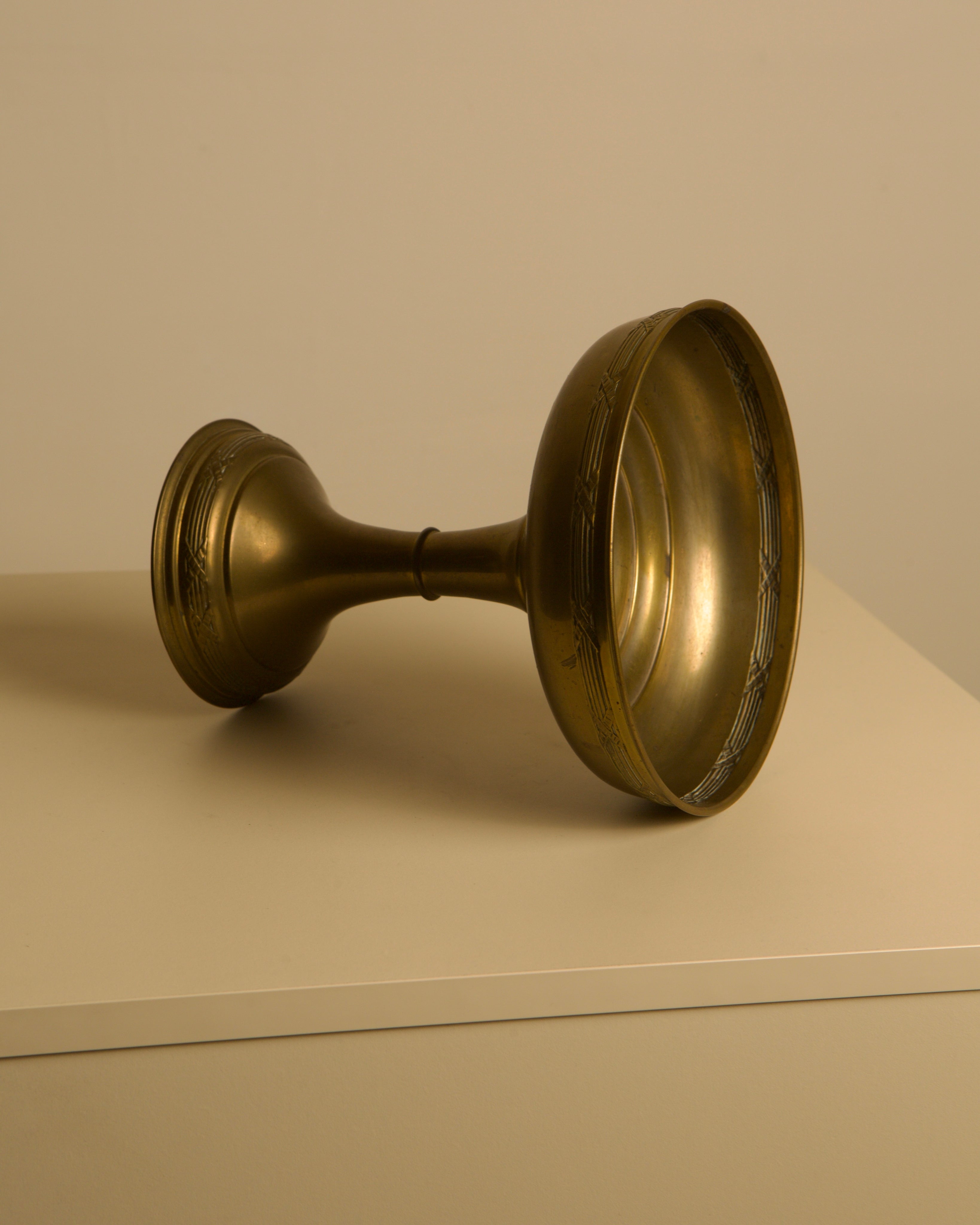 Italian brass bowl, 1960s — angled view on neutral surface