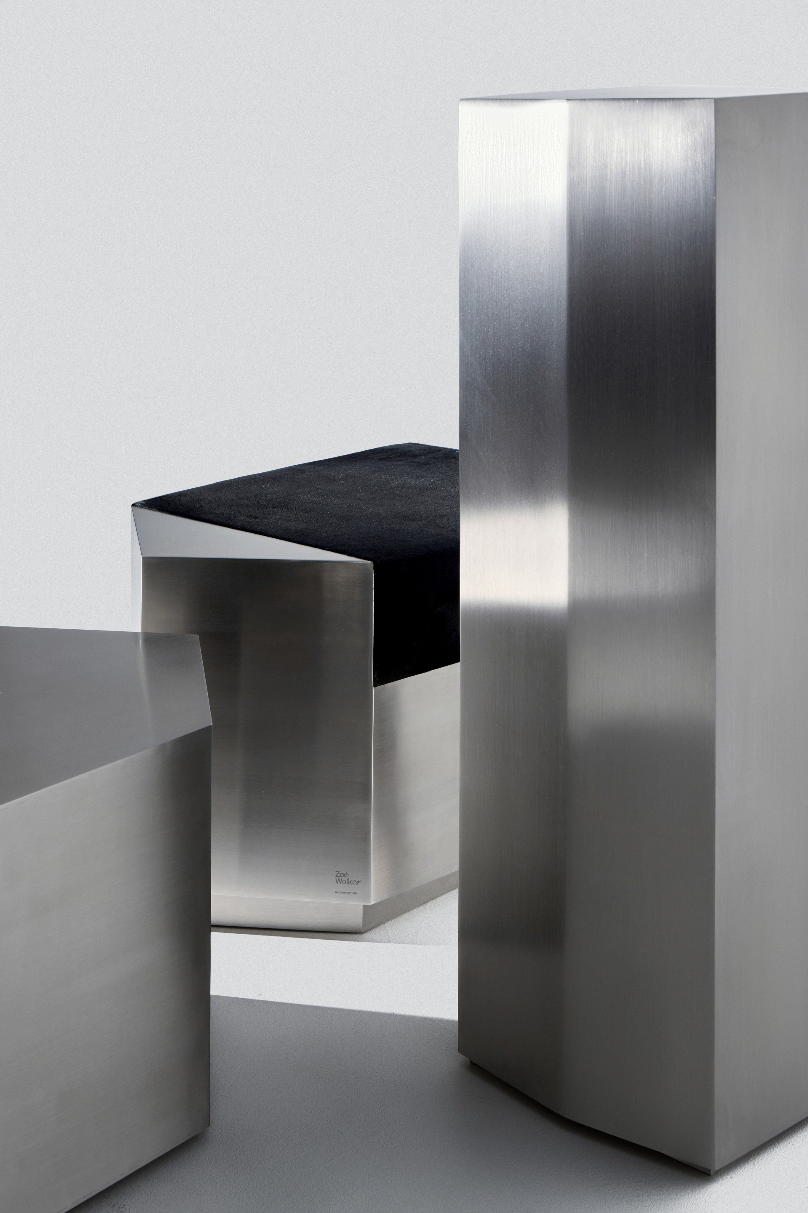Ame II' Steel Pedestal — angled view of polished steel surface