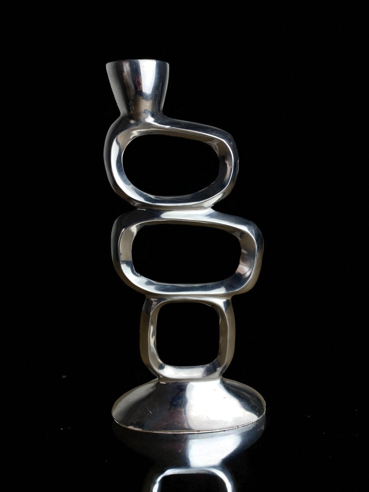Circle Candleholder by Matthew Hilton, Aluminium, 1980s — side angle showing polished metallic finish