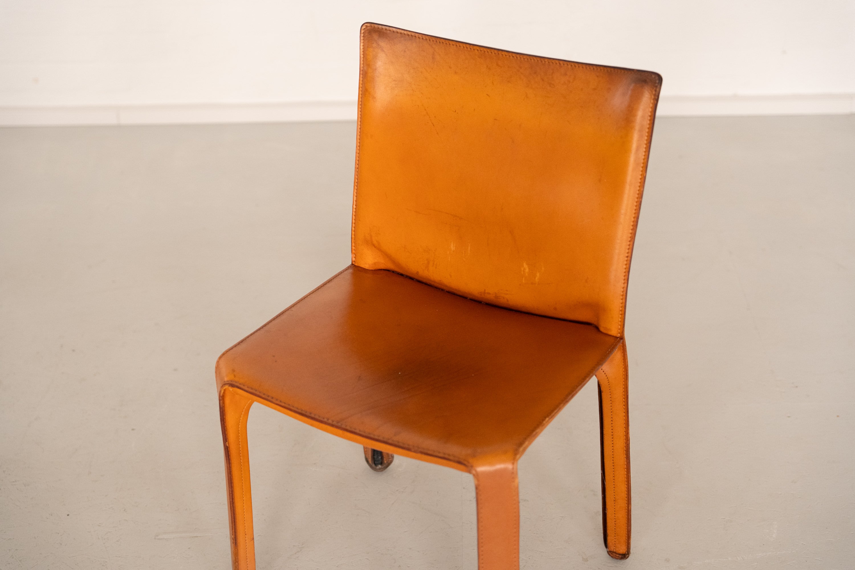 Cab 412 Chair Set by Mario Bellini for Cassina — back view of tan leather chair