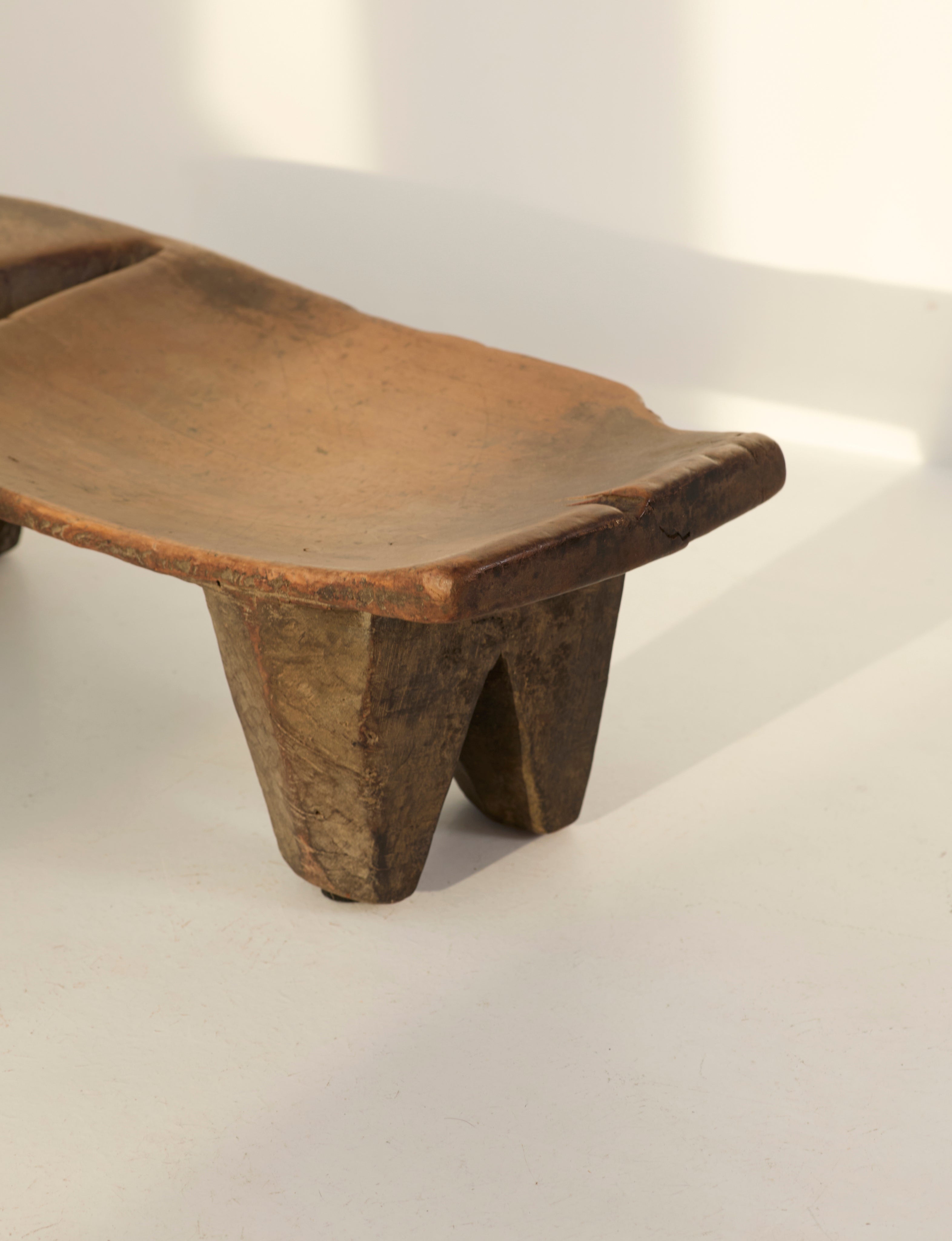 Mid-Century African Senufo Stool in solid wood — angled view highlighting natural wood grain
