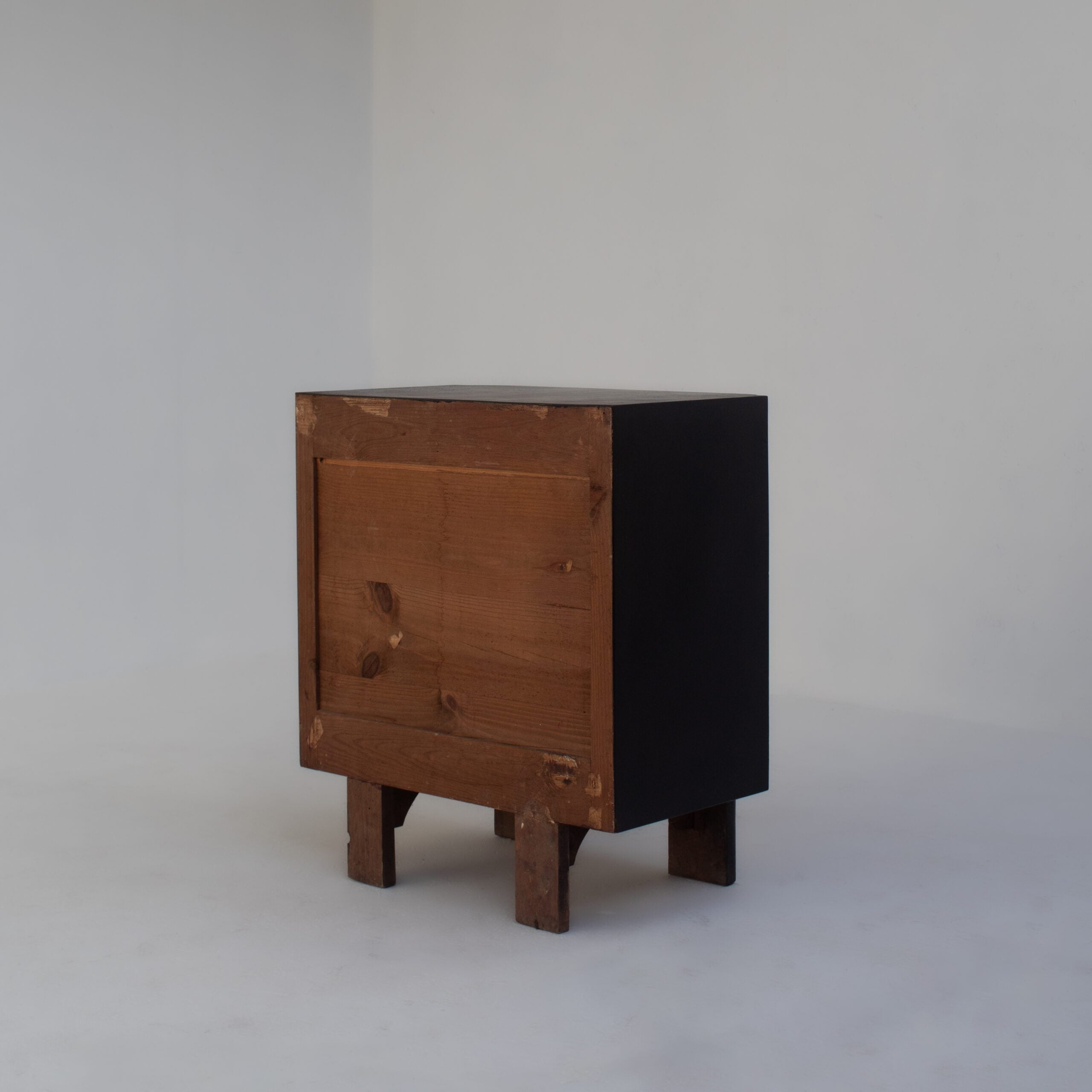 Pair of Italian Art Deco Bedside Cabinets — angled view showing wooden legs and black finish