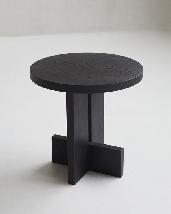 Axel Side Table in Solid Wood — close-up of round black tabletop