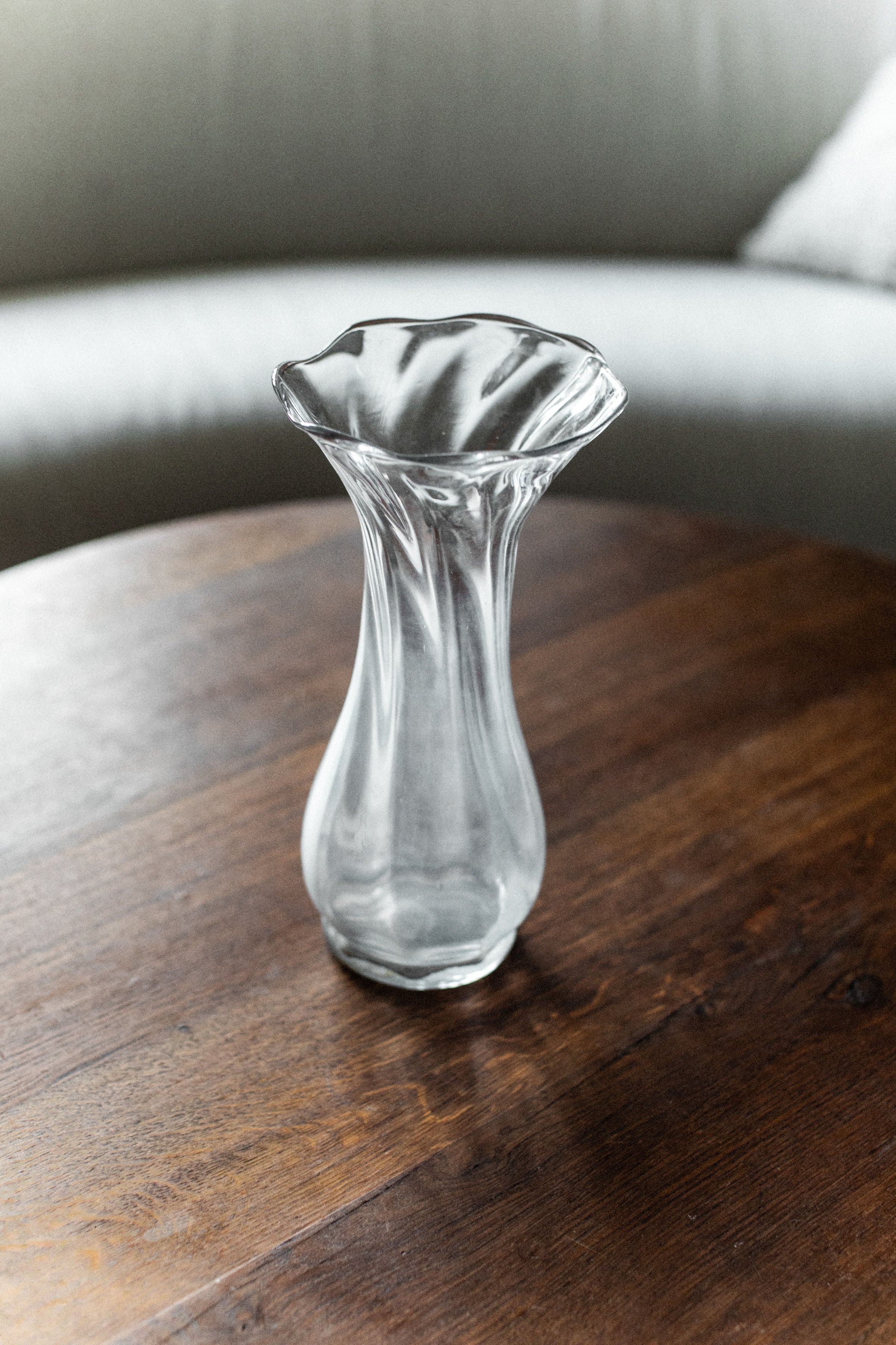 Glass Vase — side view on wooden table with soft background