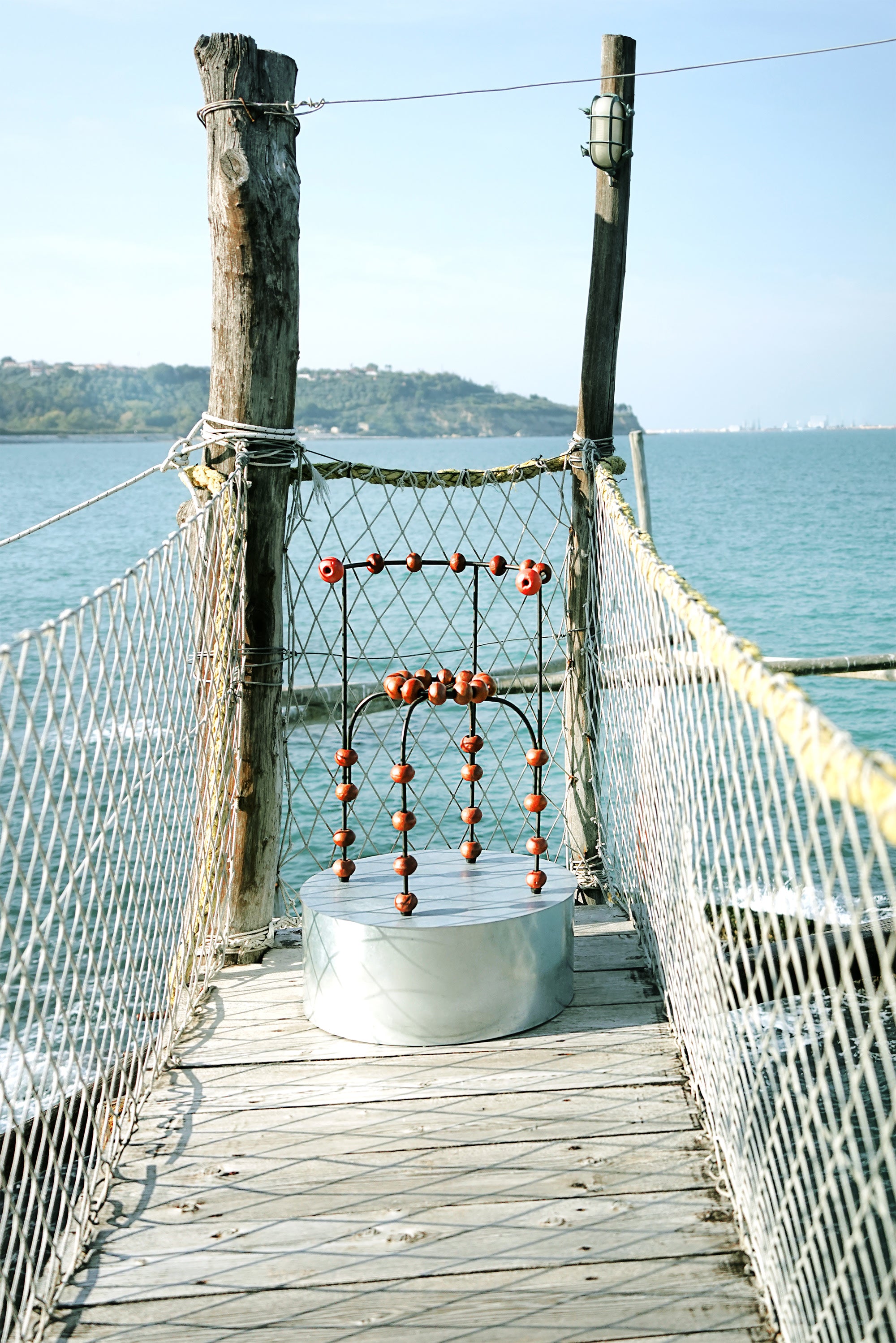The "Buoys" Chair — top view on wooden dock by water