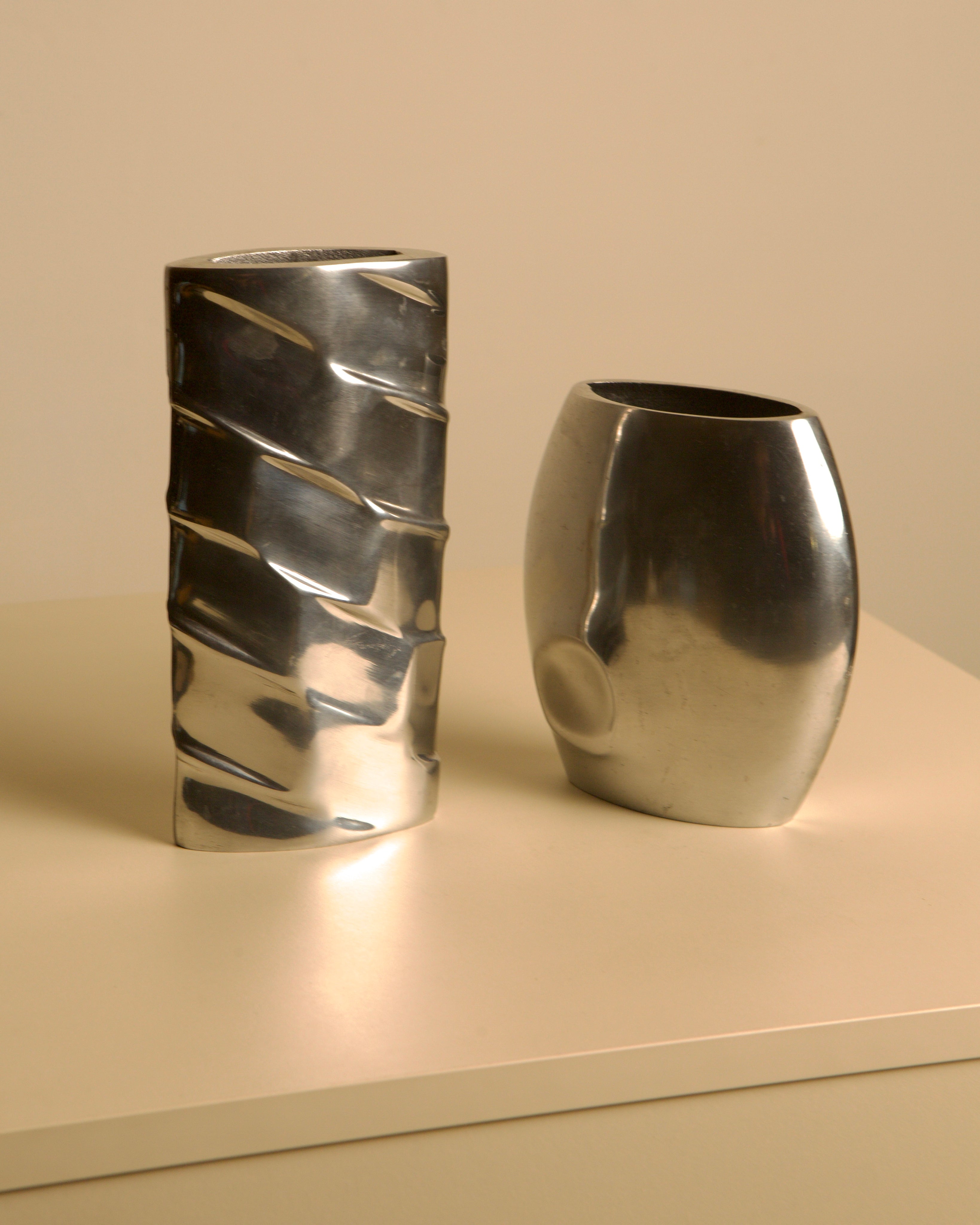 Pair of Italian Cast Aluminum Vases, 1980s — close-up of polished aluminum surface