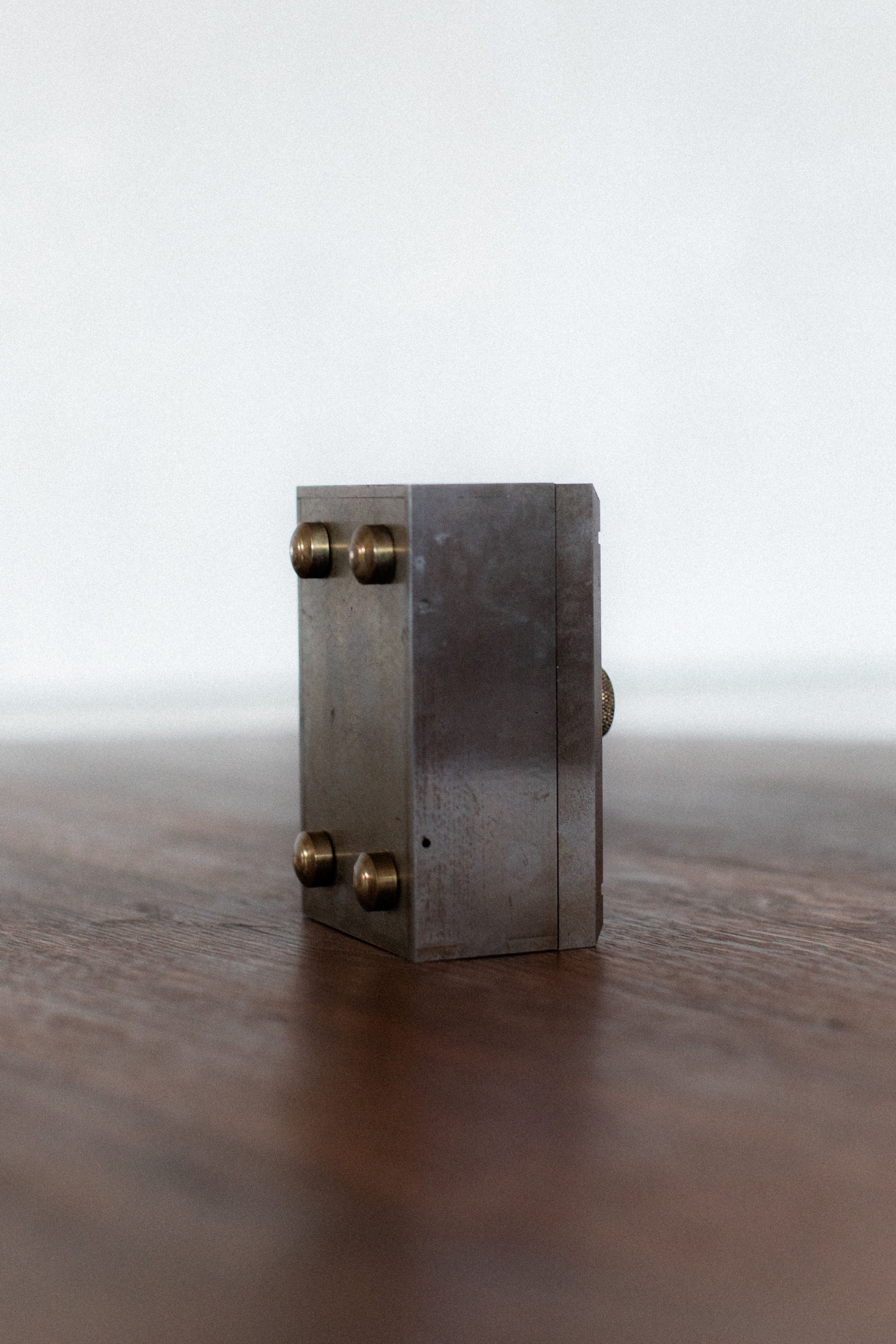 Industrial steel box with brass corner bolts detail view