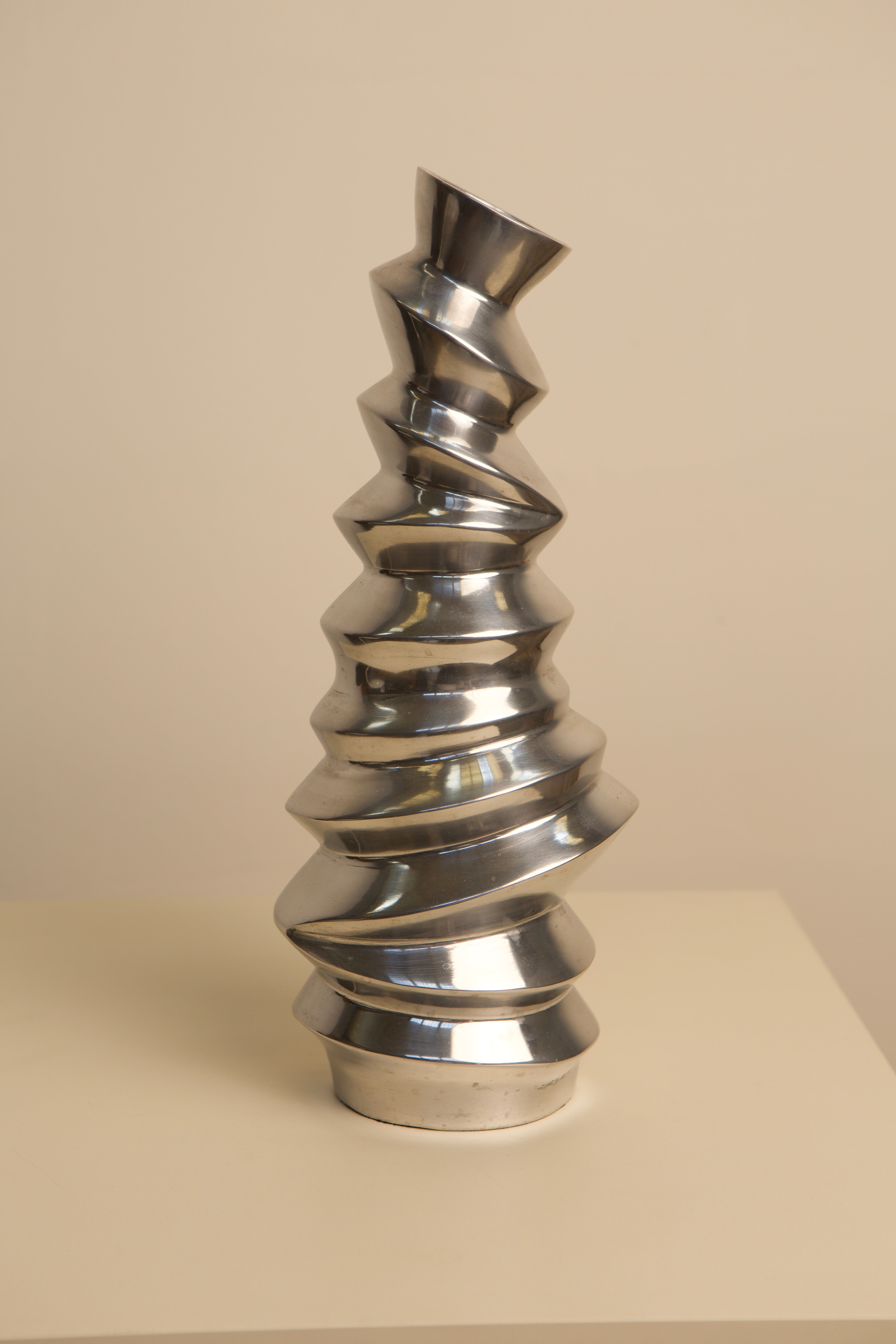 Spiral cast aluminum Italian vase with twisted metallic finish