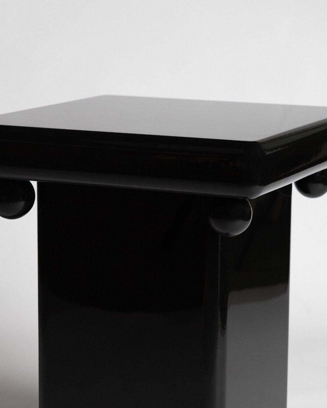 Stool - Bench in Black Laquer — top view of glossy black seat