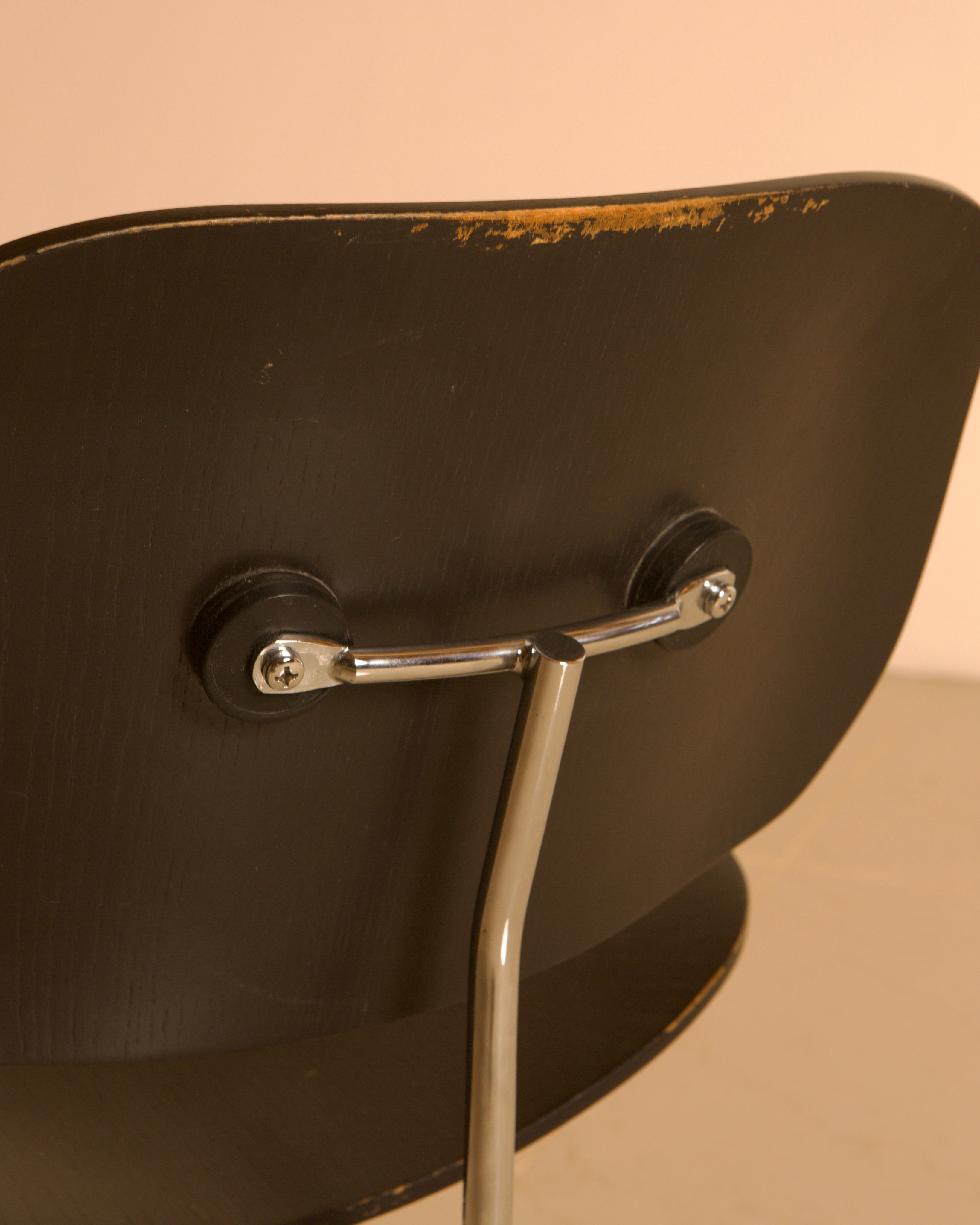 LCM Chairs by Charles and Ray Eames for Herman Miller, 1960s — top view of black wooden seat and chrome support