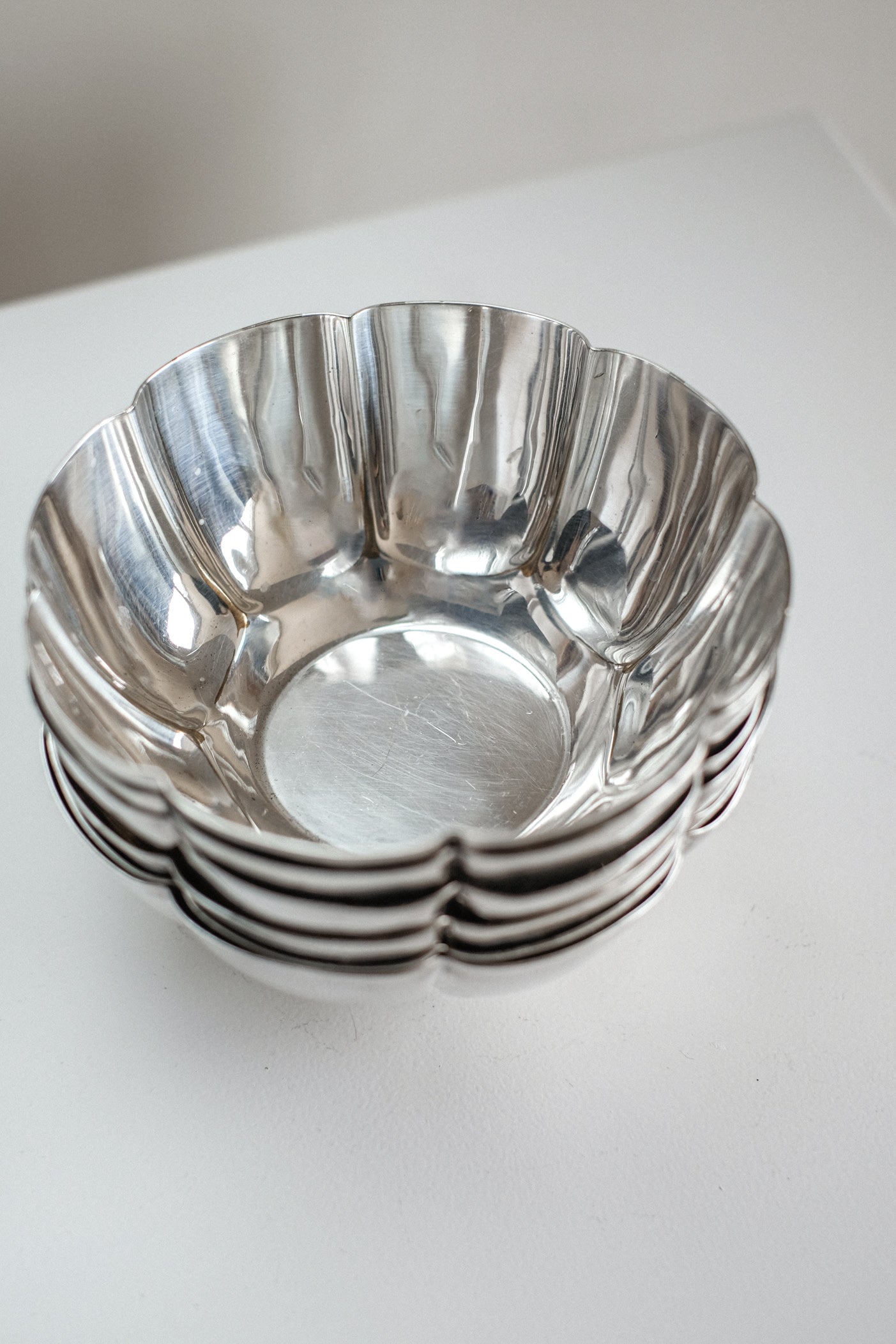Set of 6 Silver-Plated Bowls 1960s — angled view showing reflective surface