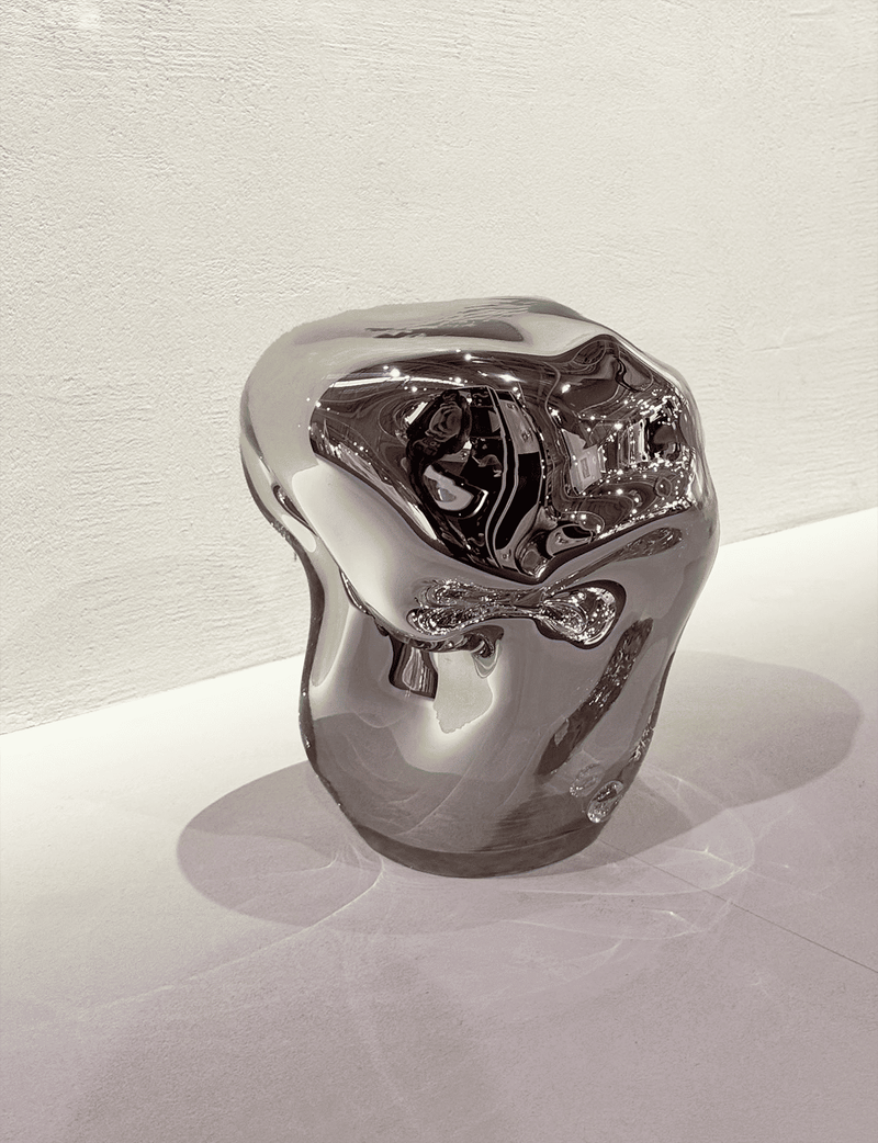 Wave Stool / Side Table II — close-up of reflective metallic surface