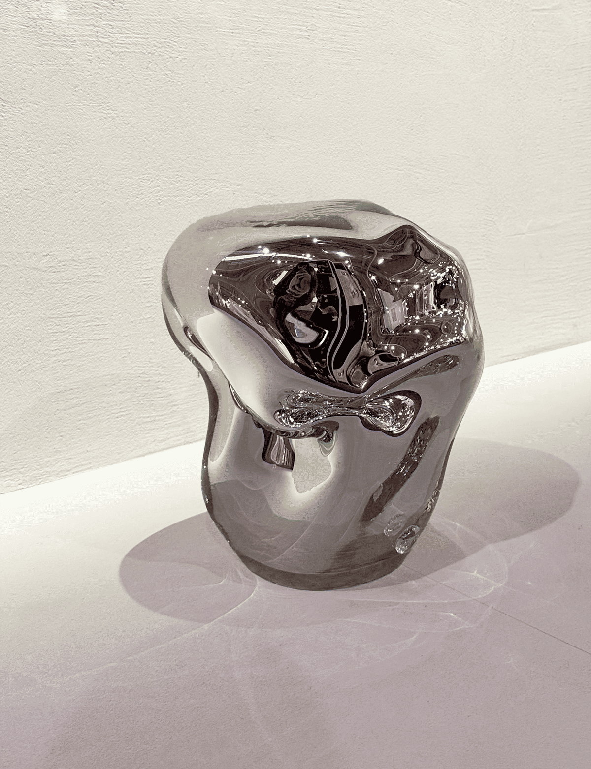 Wave Stool / Side Table II — close-up of reflective metallic surface