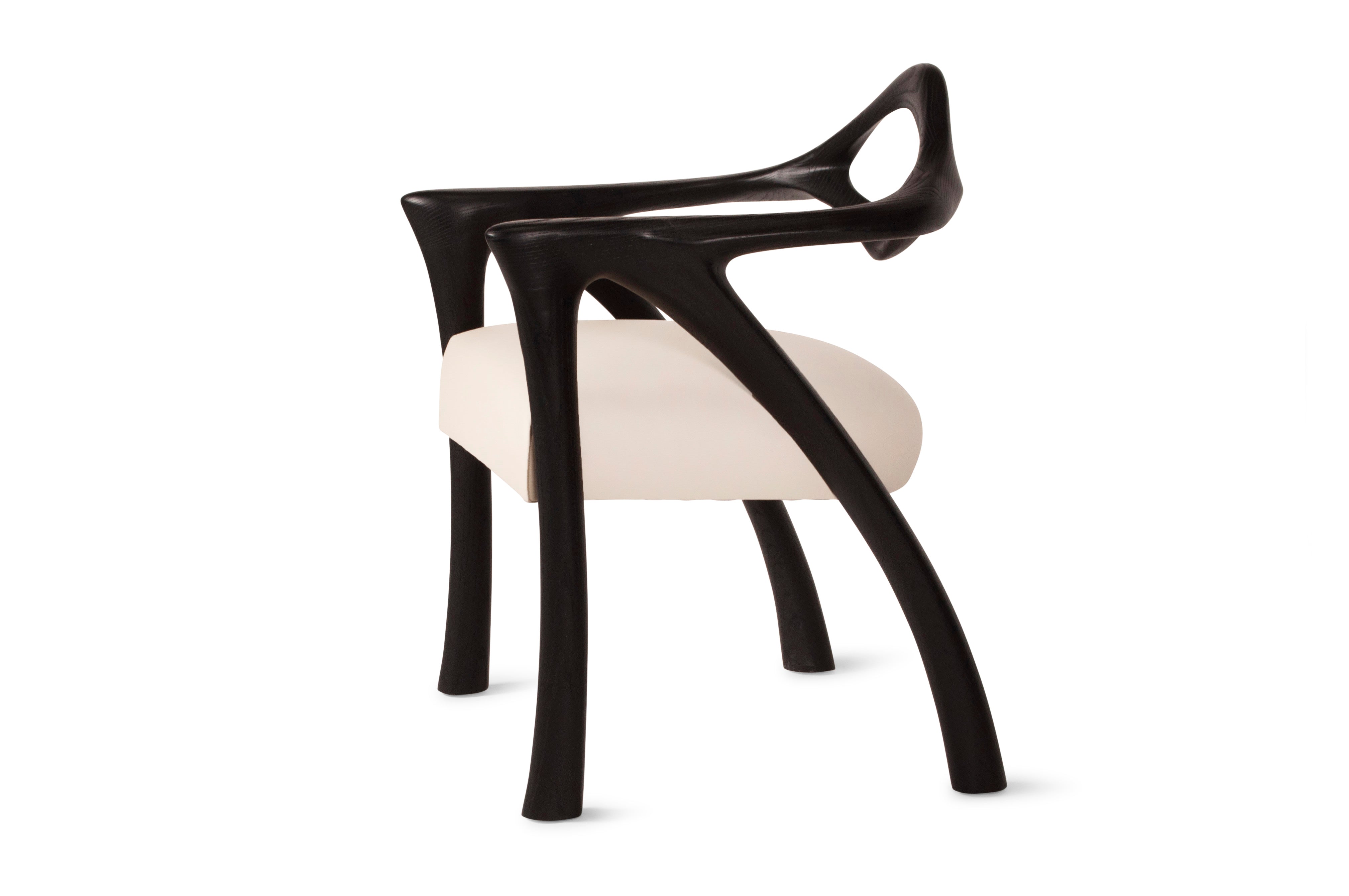 Darcey Armchair in Ash wood by Amorph — angled view highlighting curved legs and seat