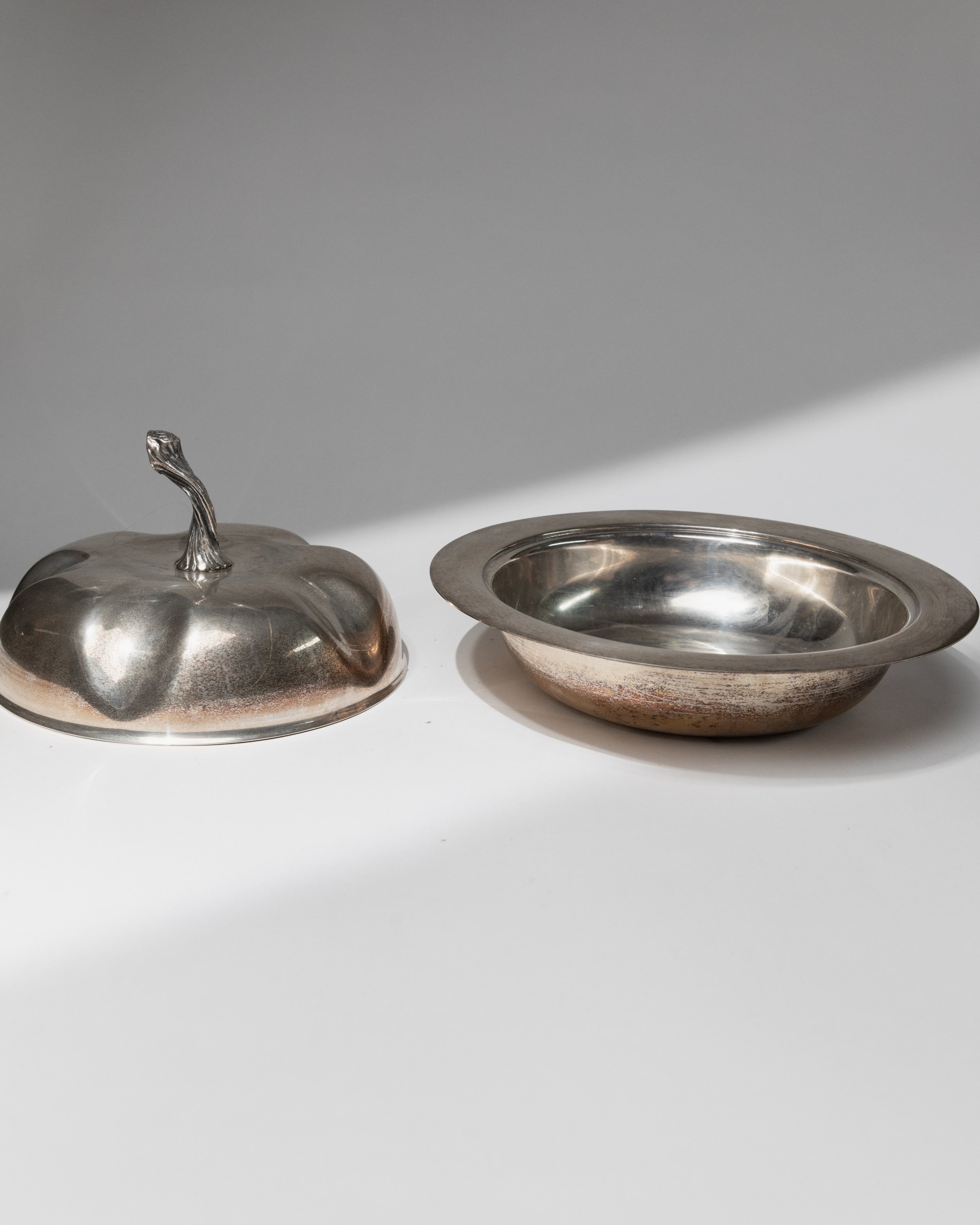 Silver plated serving bowl with pumpkin-shaped lid, separated view