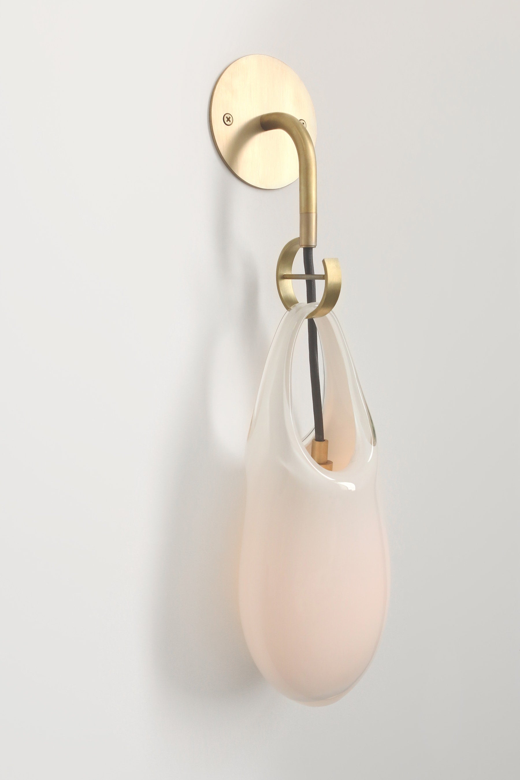 SkLO Hold 12 Sconce, White Glass, Brushed Brass, Black Cord — side angle