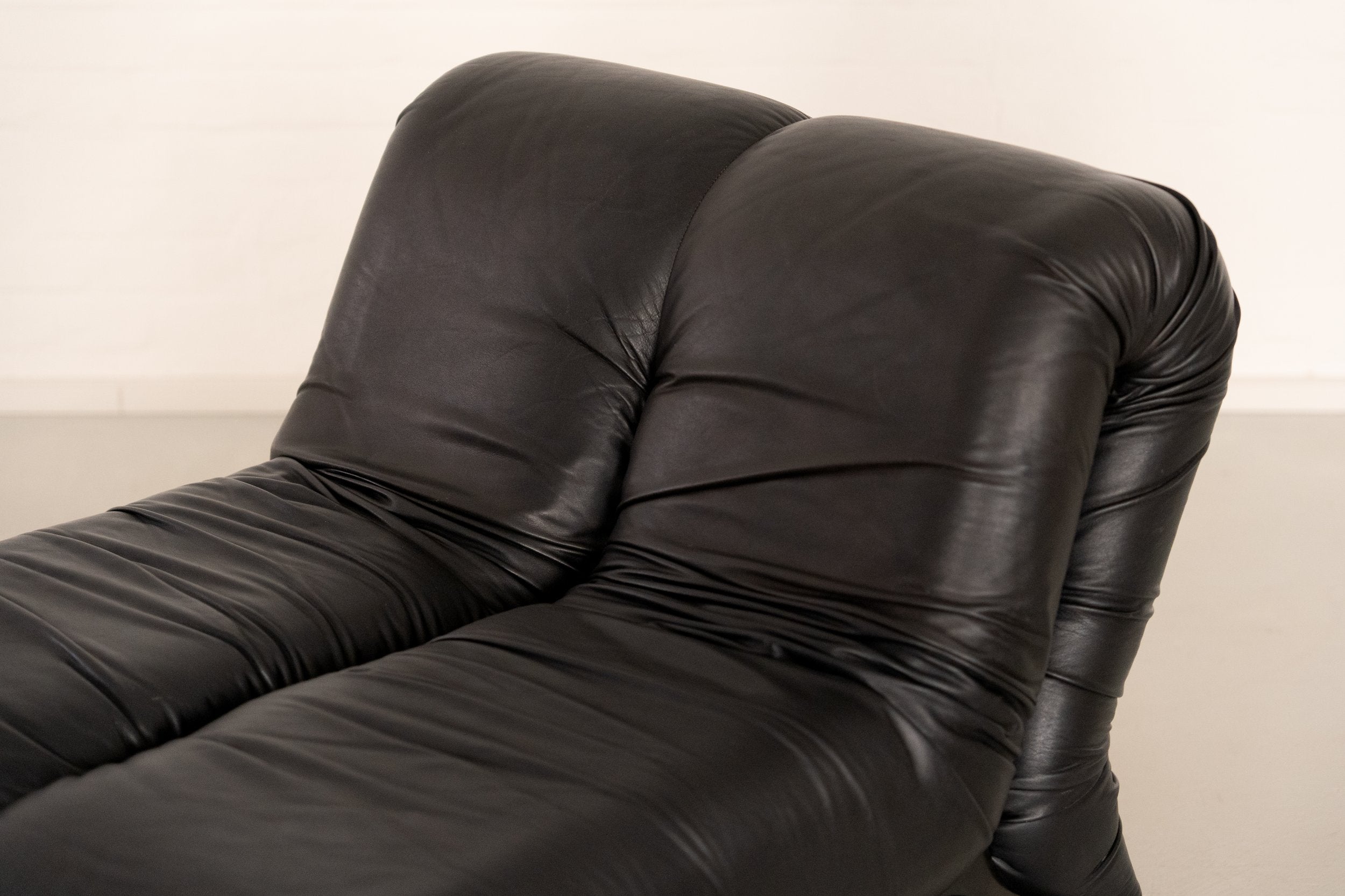 Pagru Lounge Chair by Claudio Vagnoni for 1P — back view of black leather upholstery
