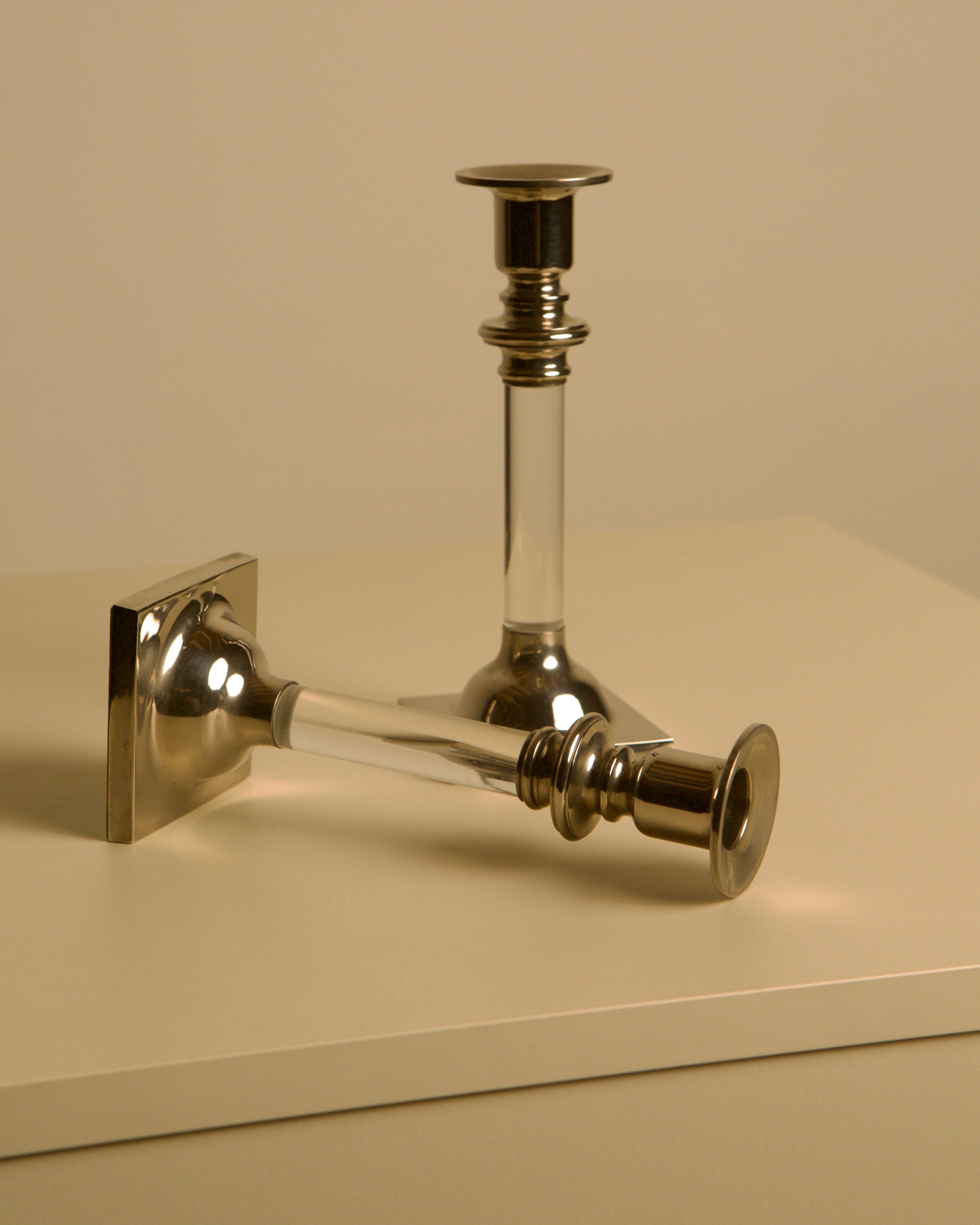 Pair of Italian Candleholders in Lucite and Silver-plated Metal, 1980s — side angle on neutral background