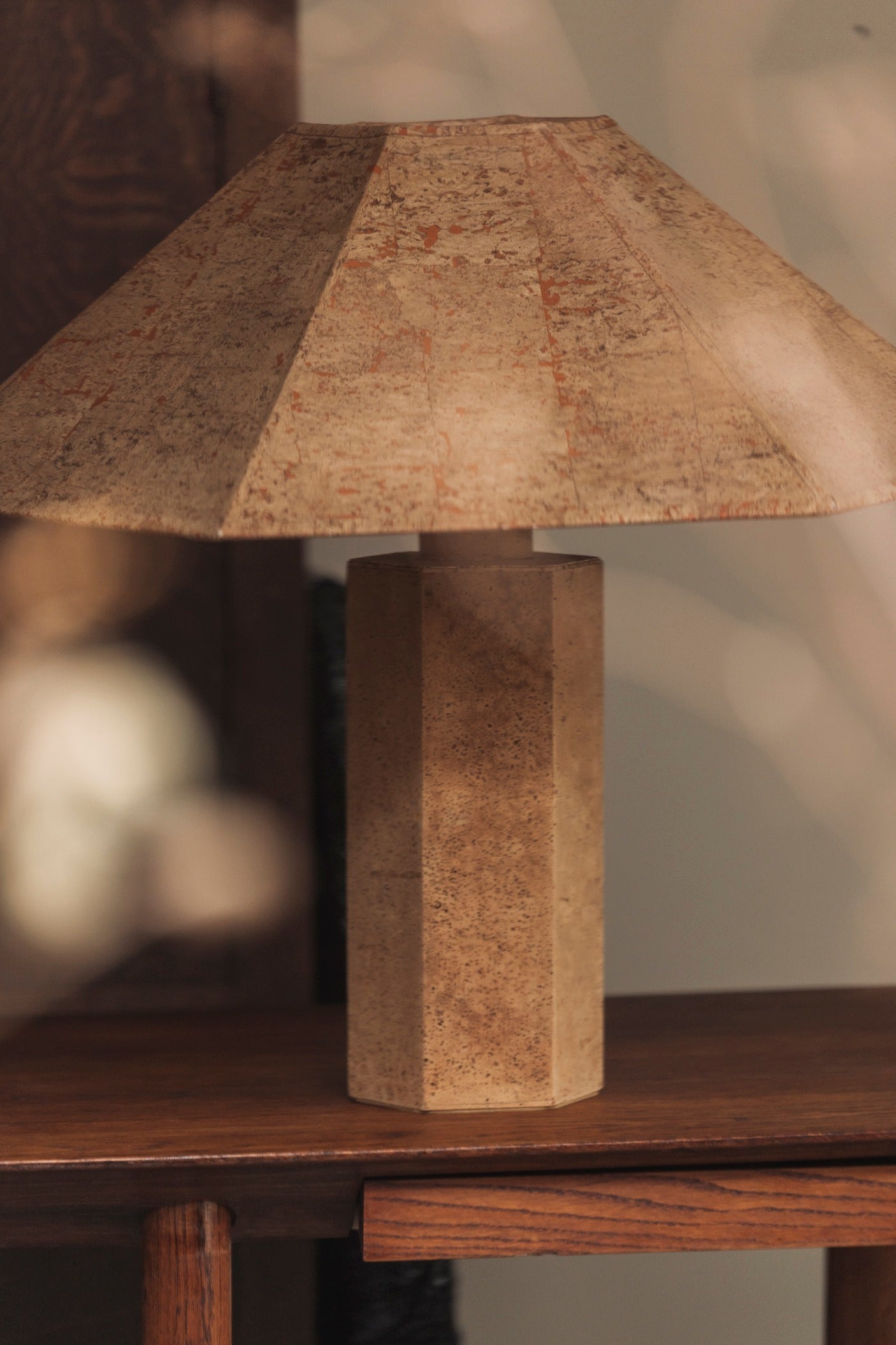 Hexagonal Cork Table Lamp by Ingo Maurer for M Design, Germany 1970s — close-up view on wooden side table