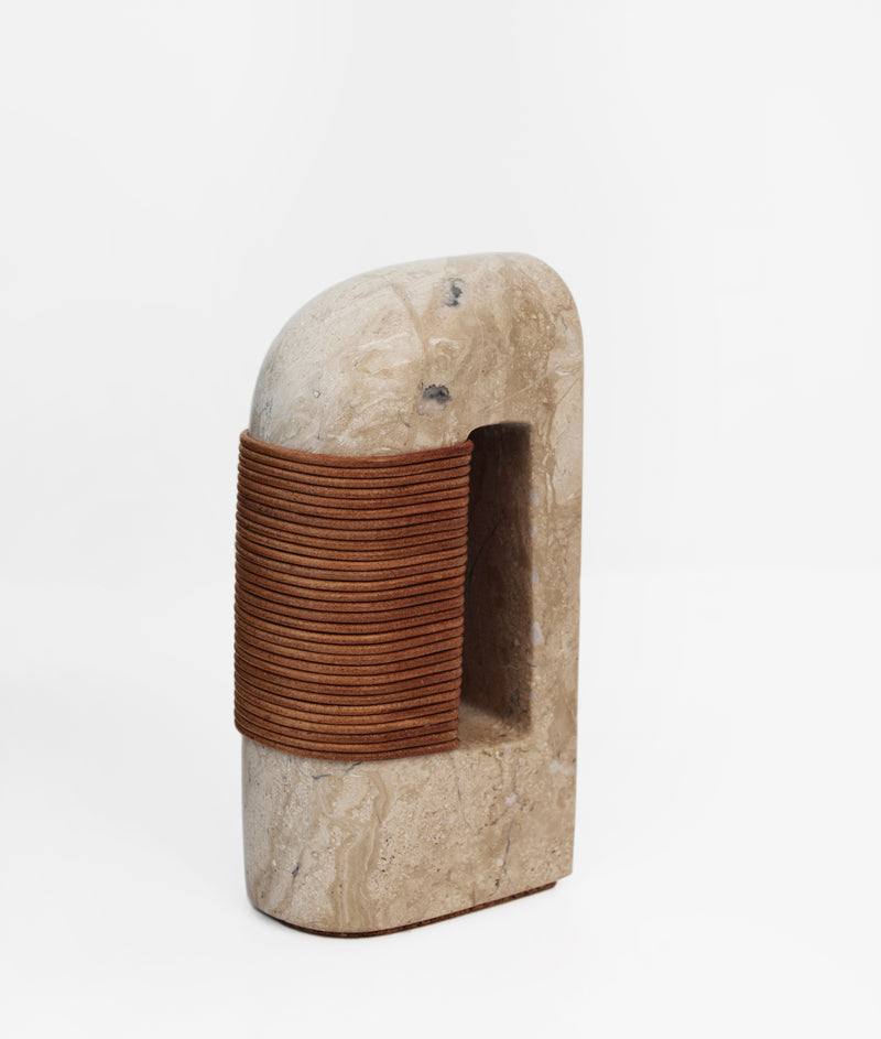 Fane bookend carved stone with leather cord binding detail