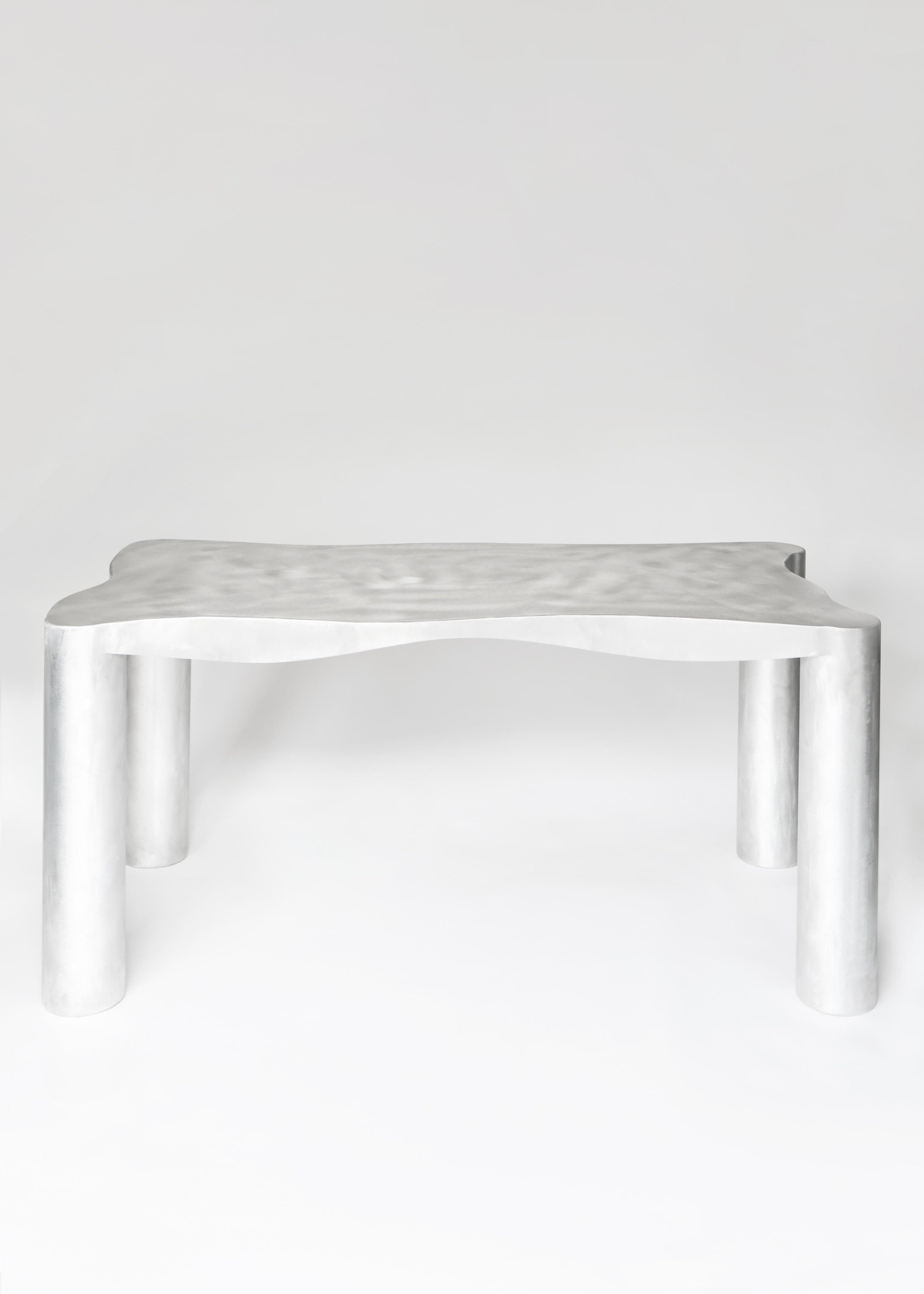 Aluminum Dining Table — top view of textured surface and legs