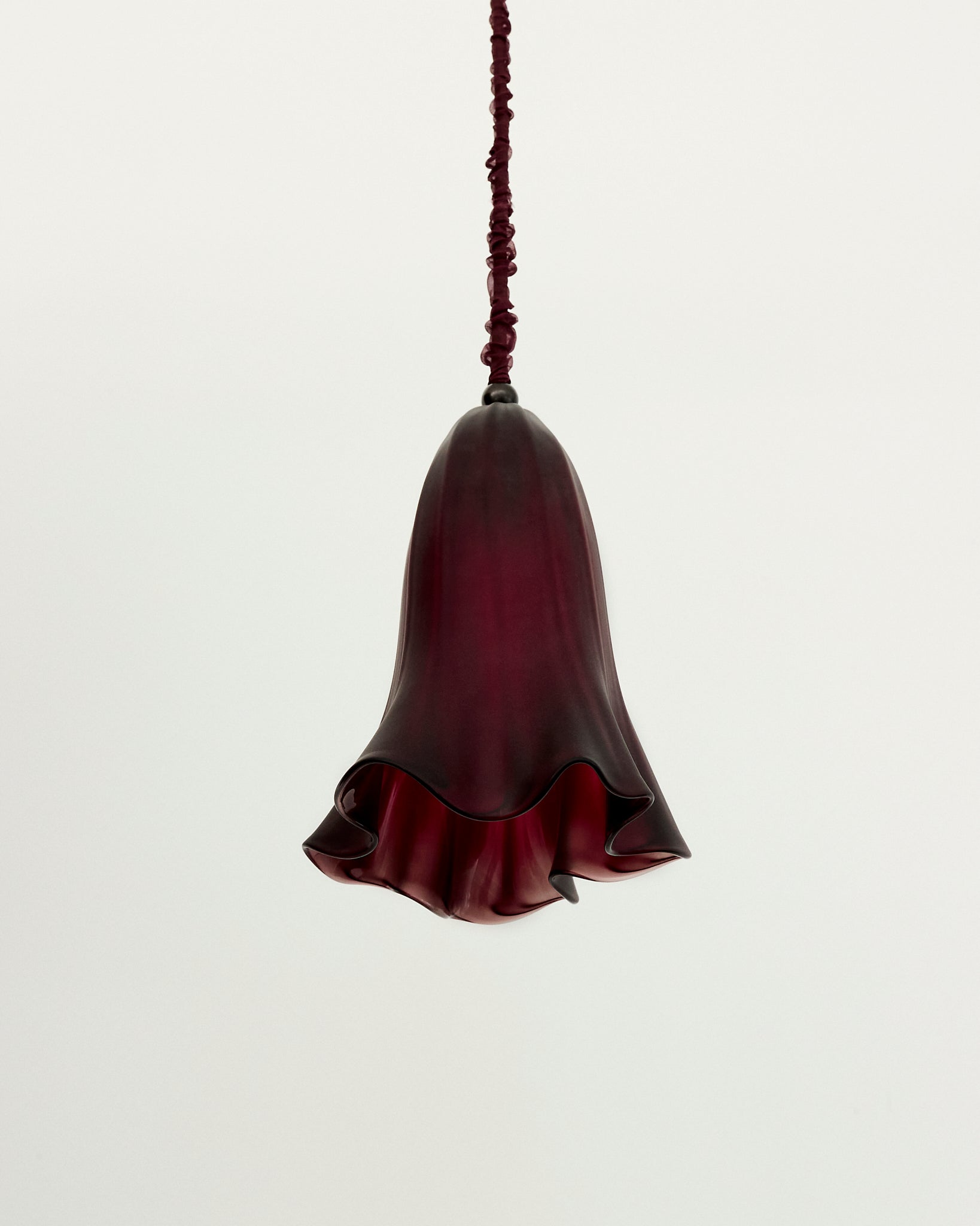 Monocle Pendant — close-up