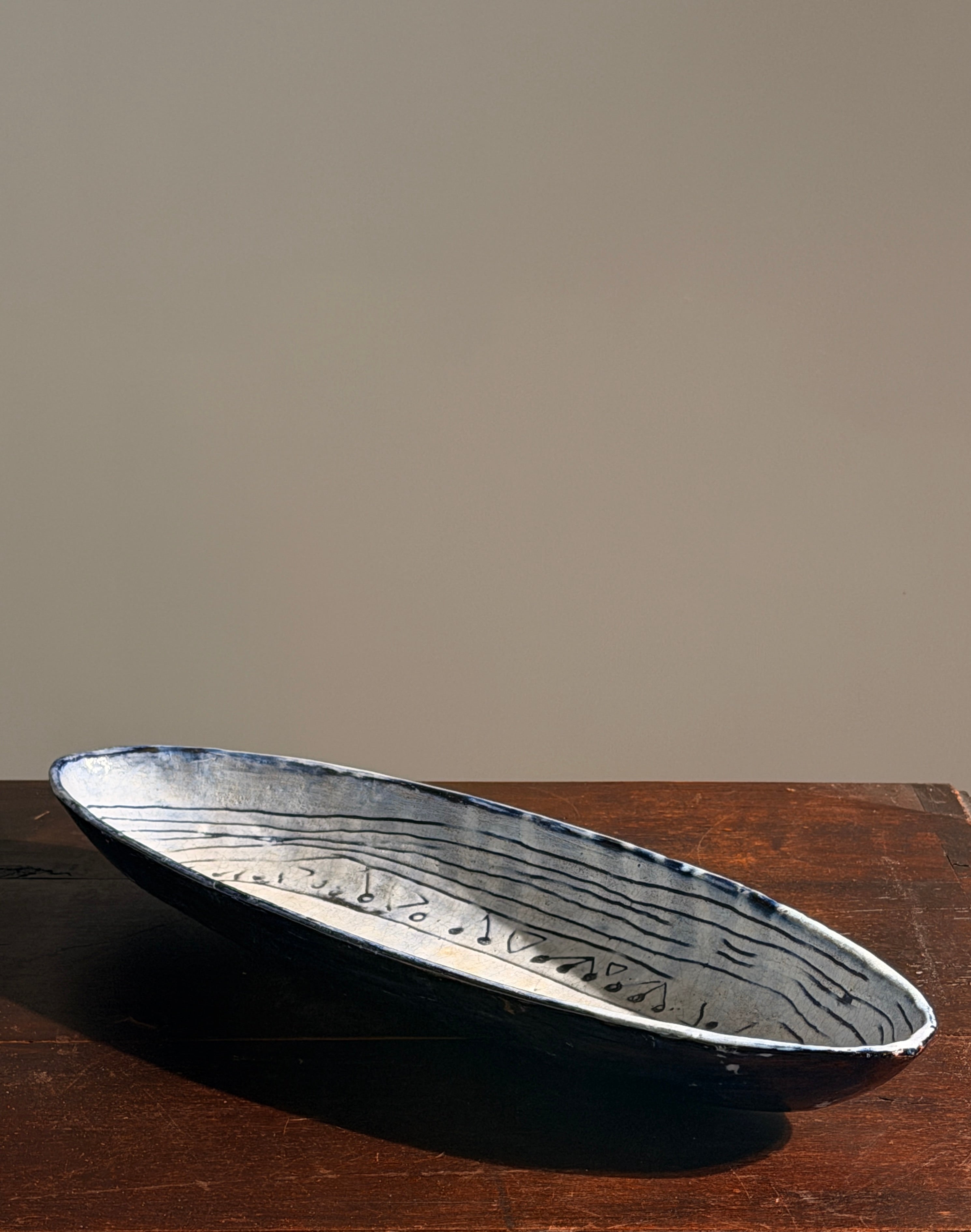 Large navette dish in glazed ceramic, signed Acly, France, 1964 — lifestyle setting