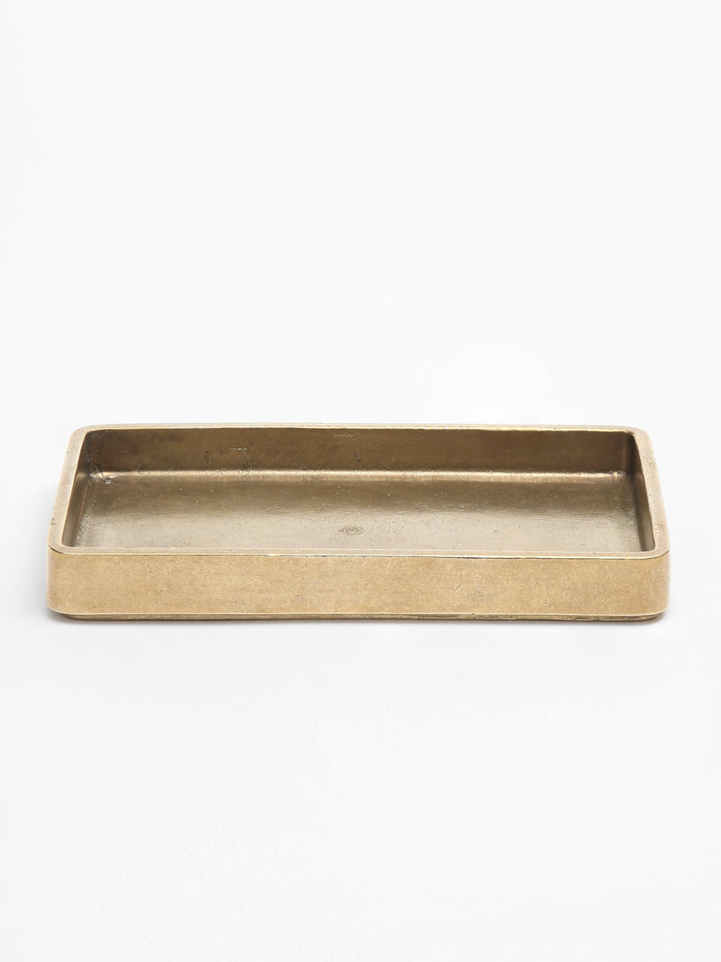 Plato Table Tray — close-up of brass surface with raised edges