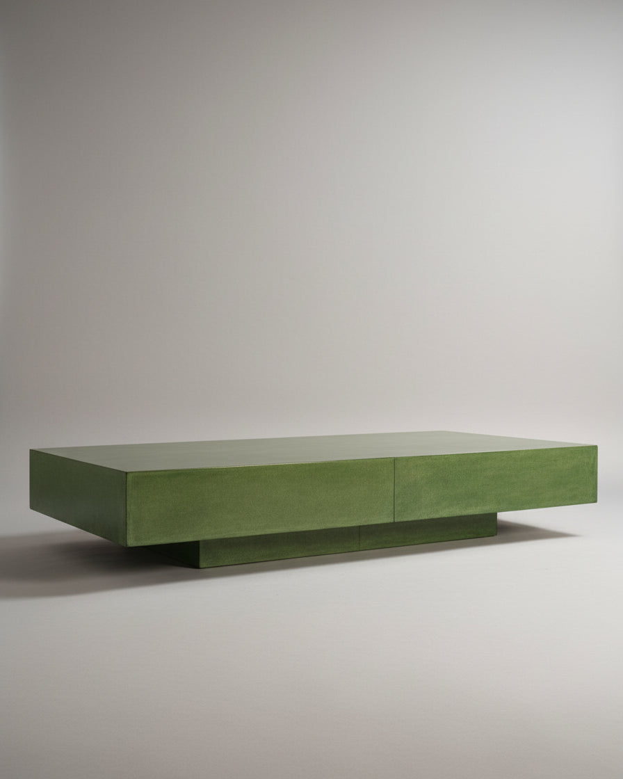 The Green Parchment Table by Galerie Vauvart features clean lines and a low, pedestal-style base in Aldo Tura style. This modern rectangular coffee table in green parchment is displayed against a plain light gray background.