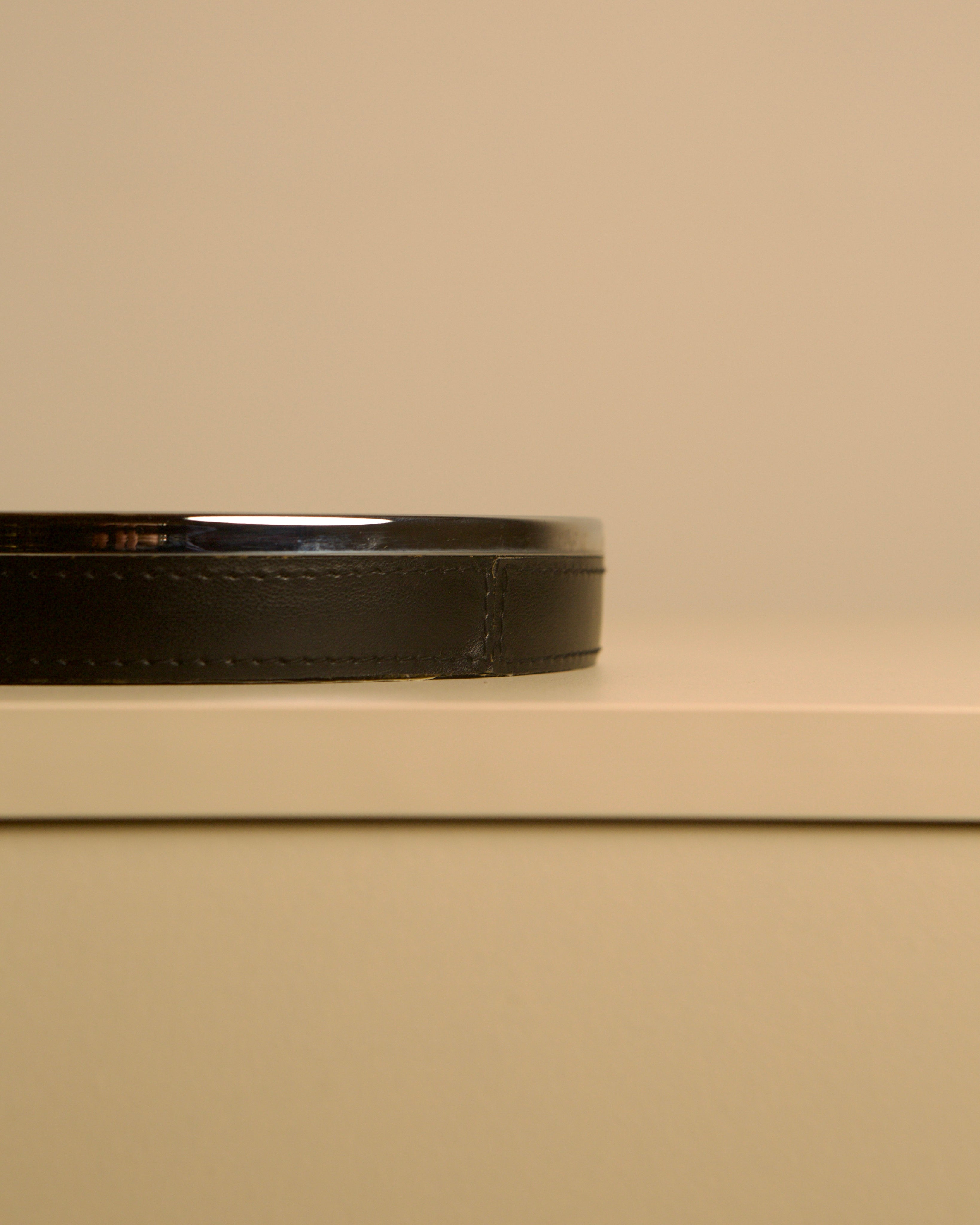 Italian Metal and Black Leather Valet Tray, 70s — close-up of black leather edge