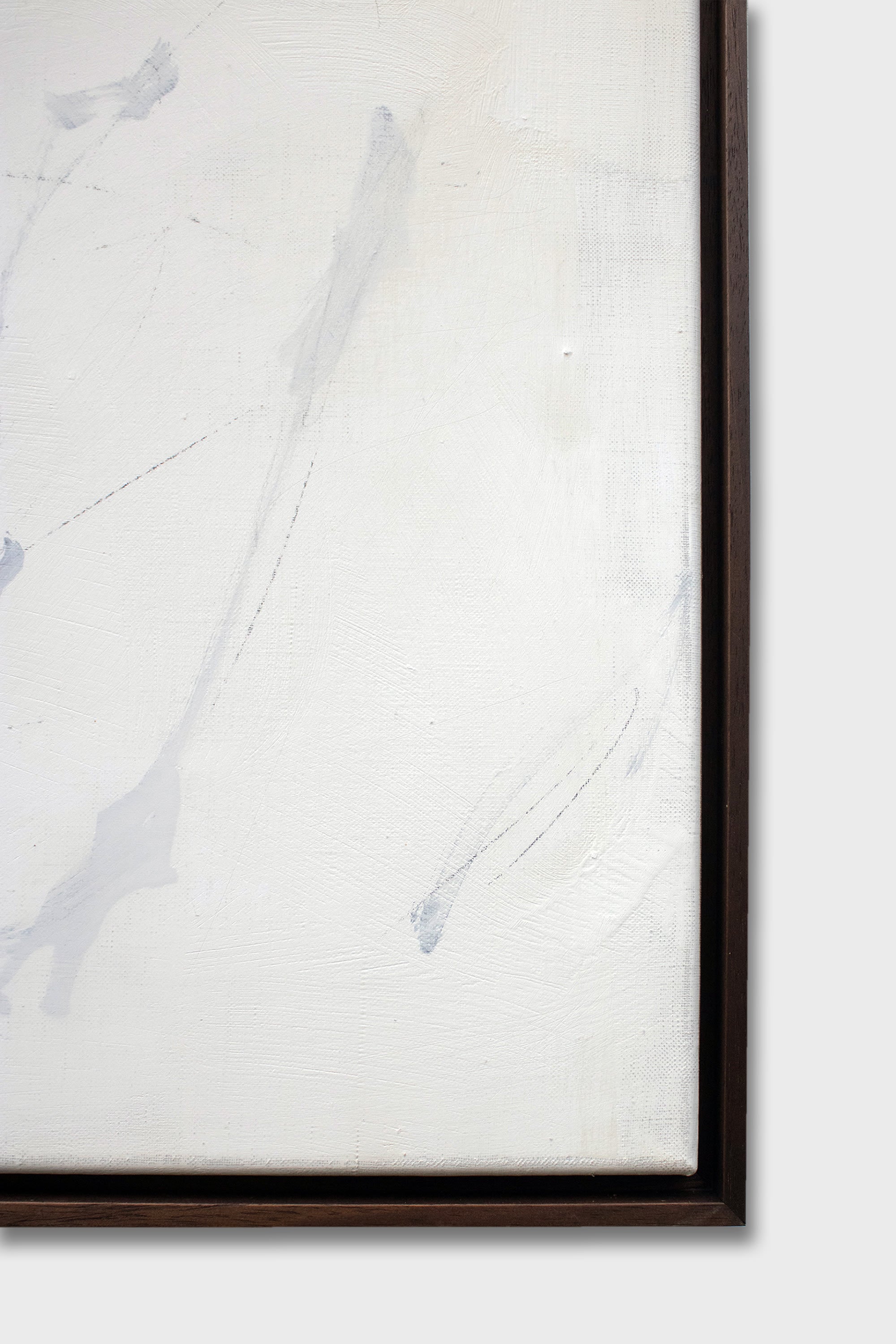 Close-up detail of white abstract mixed media painting with subtle brushstrokes