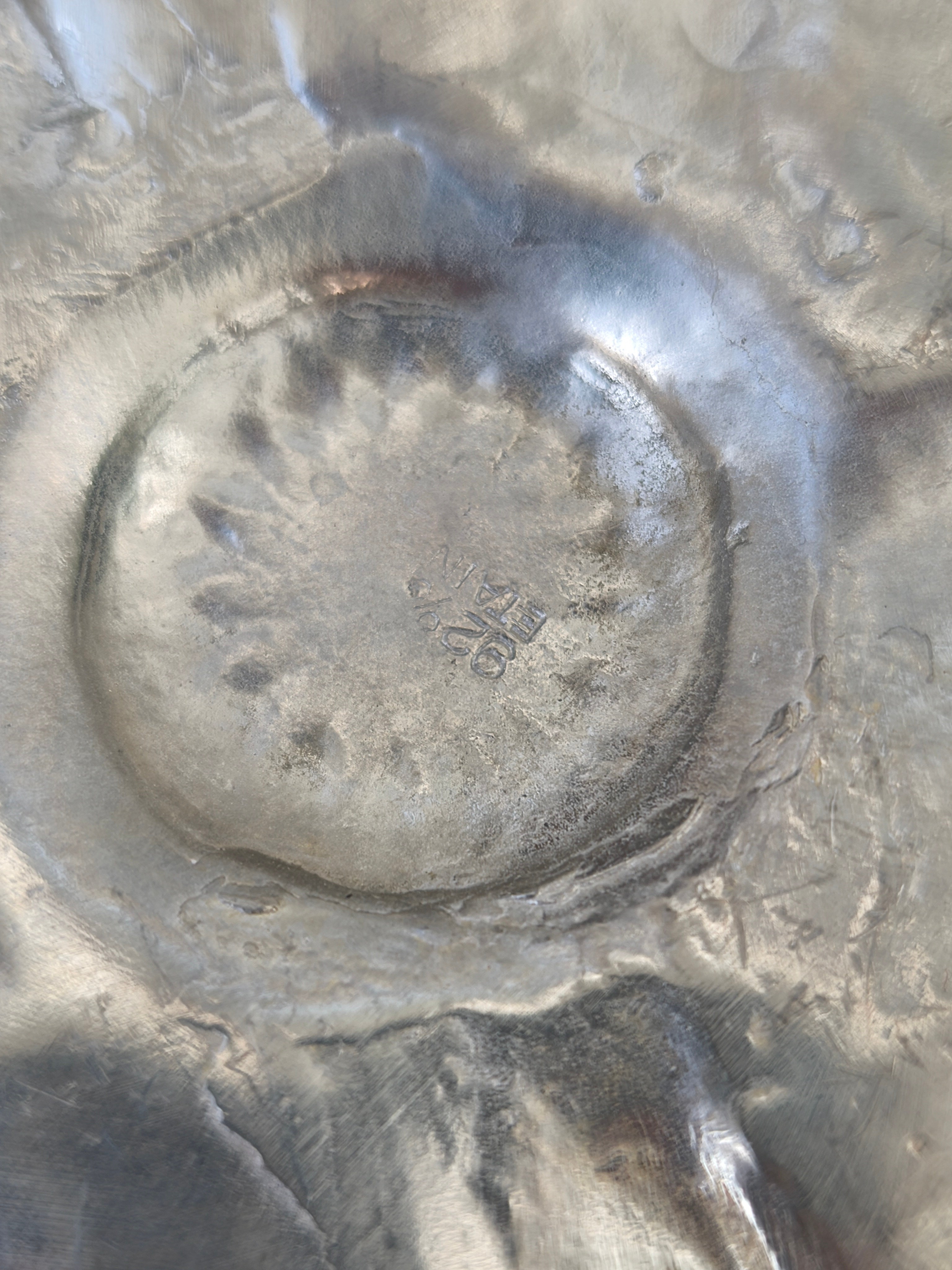 Flower pewter vide poche — top view of textured pewter surface