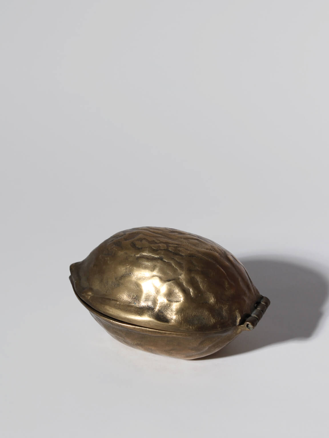 Vintage Brass Nutcracker Walnut, 1960s — close-up of hammered brass texture