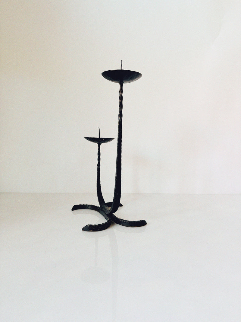 Forged Metal 2 Arm Candlestick, Poland — close-up of twisted black metal design