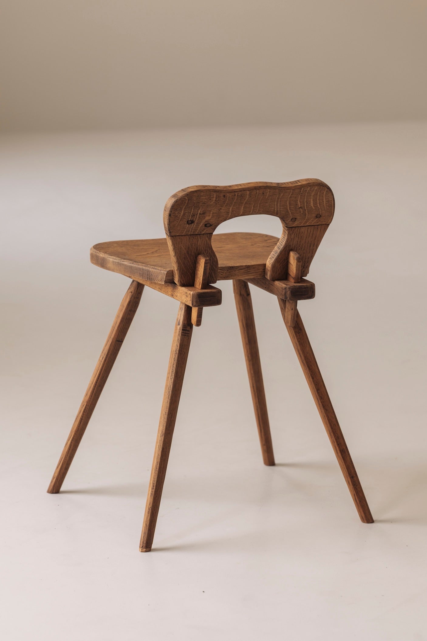 Sculptural pair of French solid oak side chairs from the 1950s — in context
