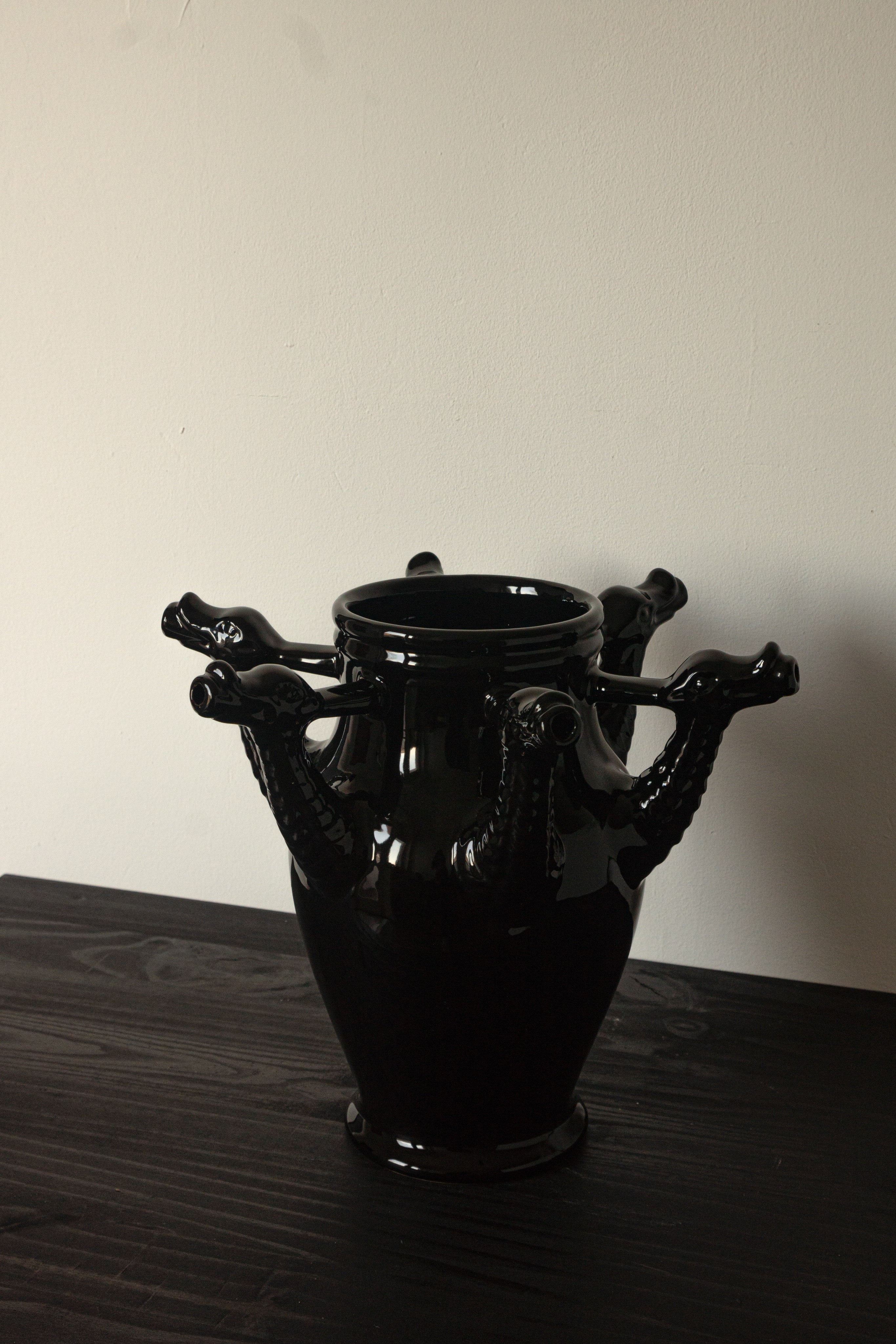 The Drago Nero - Minimalist Vase in Ceramic — side angle showing black ceramic with dragon handles