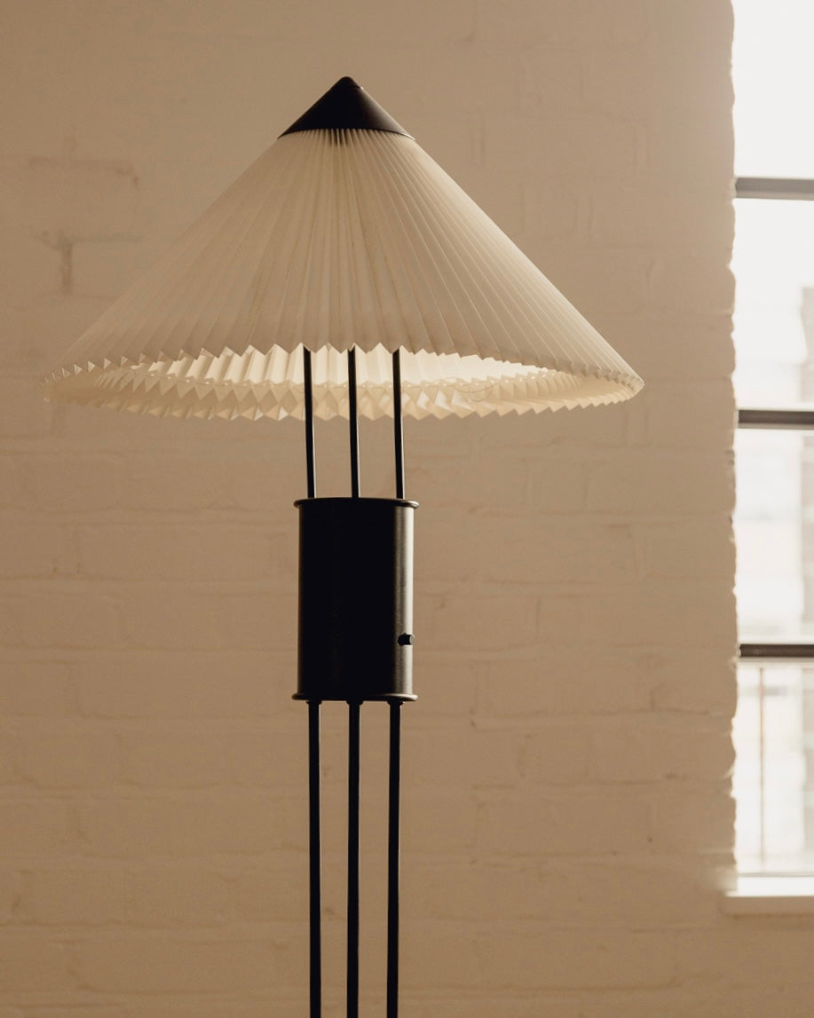 Le Klint Floor Lamp — close-up of pleated white shade and black base