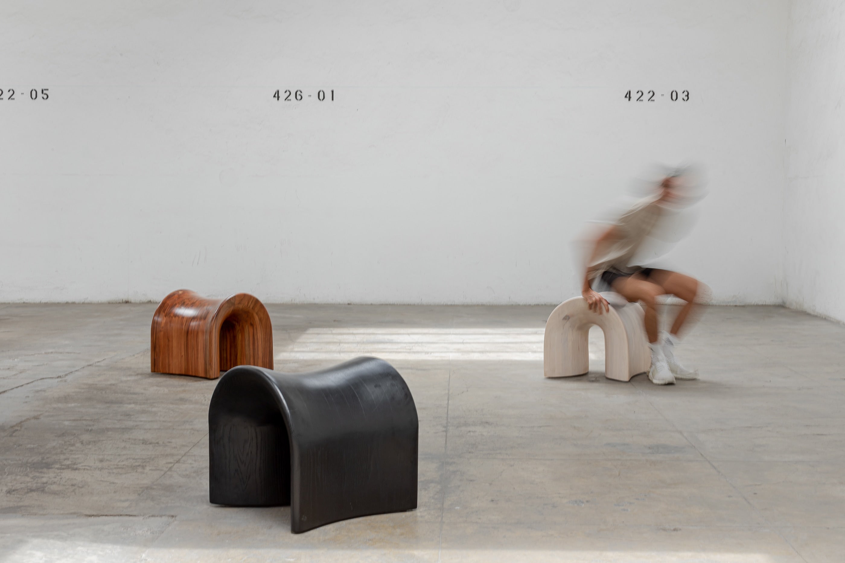 TORO Oak Stool — side angle in minimalist gallery setting