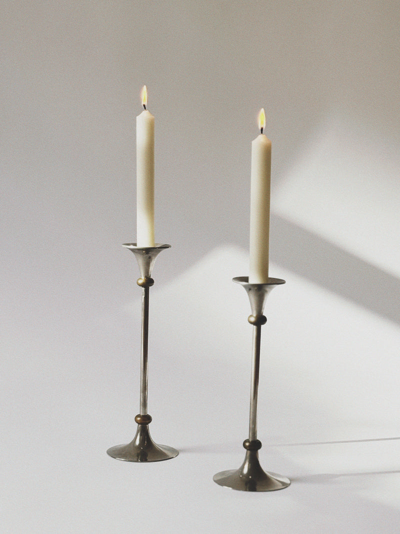 2 Metal Postmodern Candleholders — close-up of polished metal finish