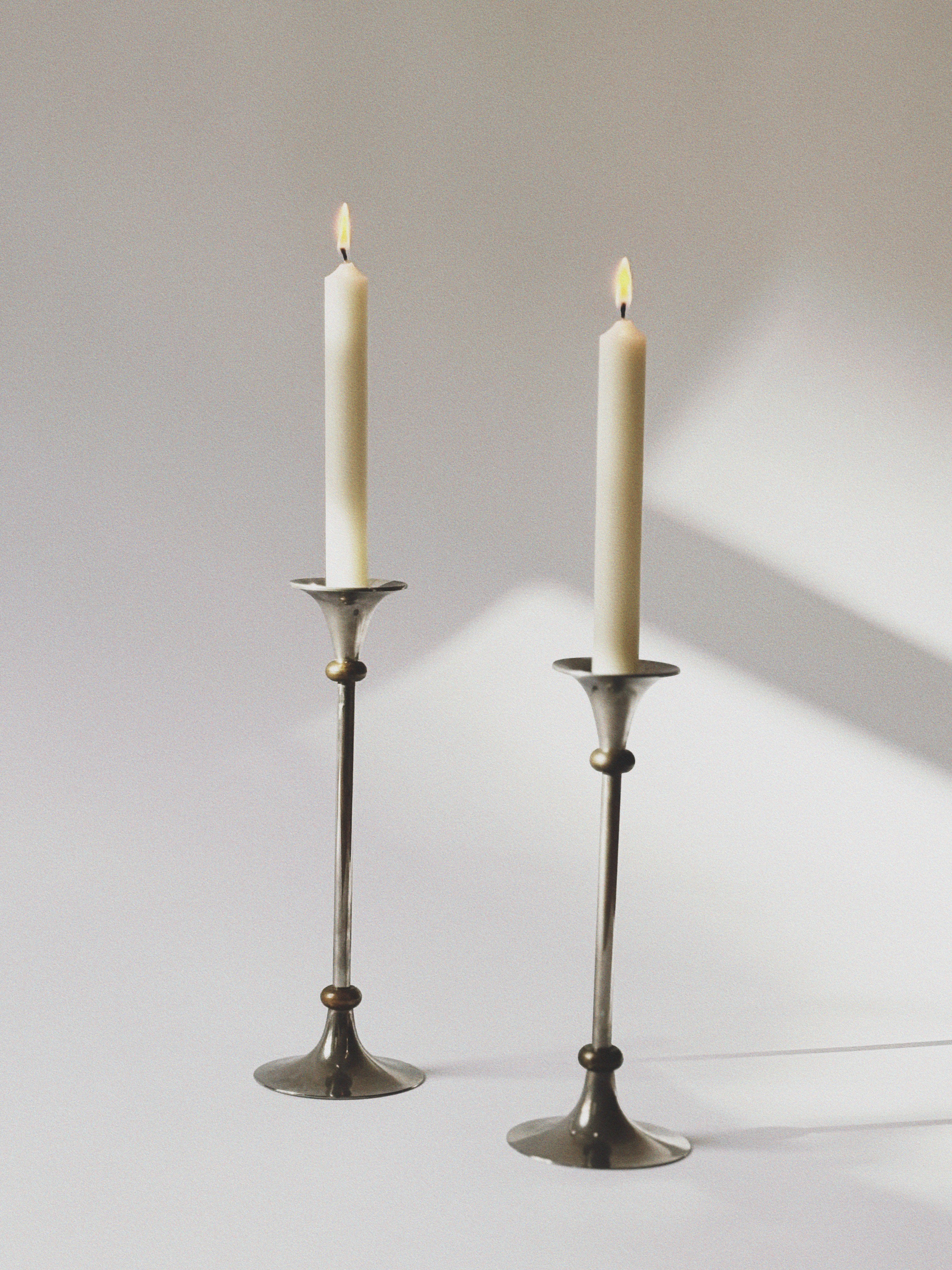2 Metal Postmodern Candleholders — close-up of polished metal finish