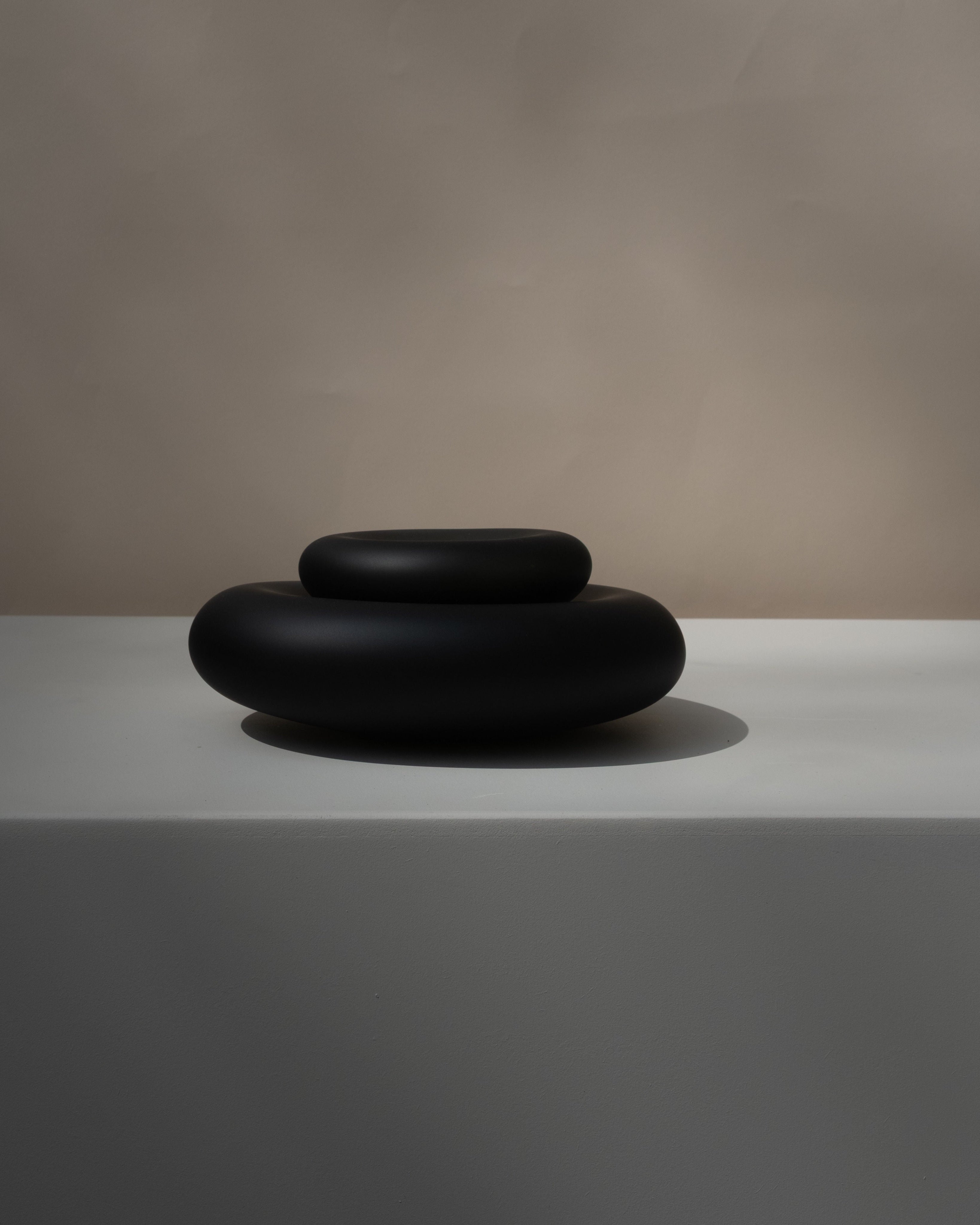 Glass Sculptures SEAGLASS | color midnight black — side view on light surface