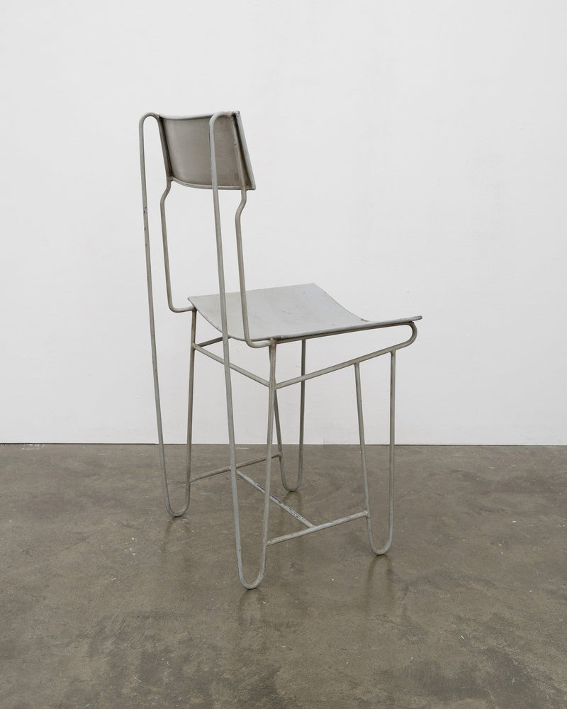 Modernist Steel Chair — side view highlighting industrial metal frame