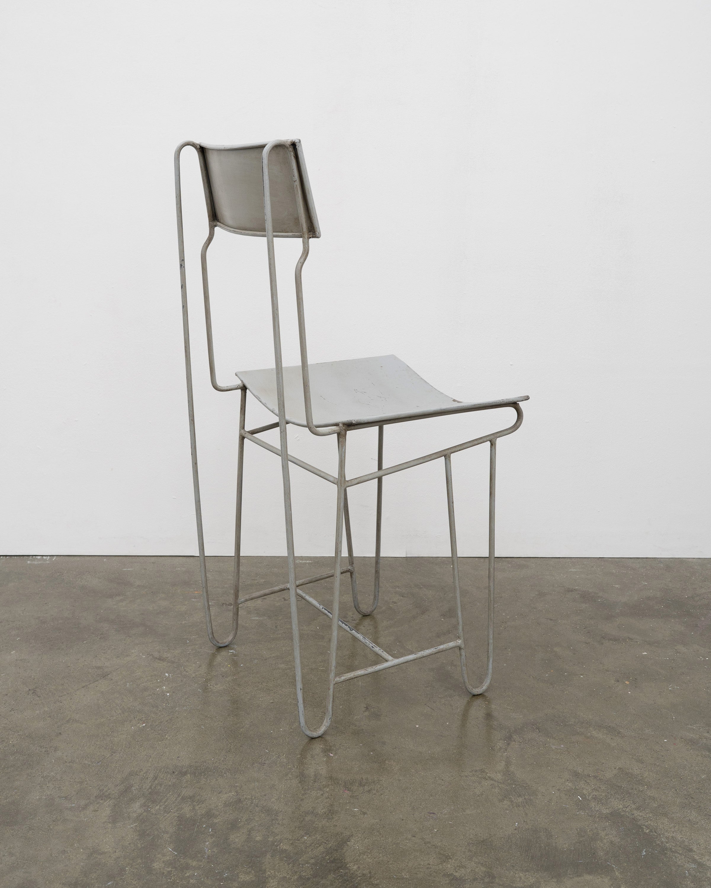 Modernist Steel Chair — side view highlighting industrial metal frame