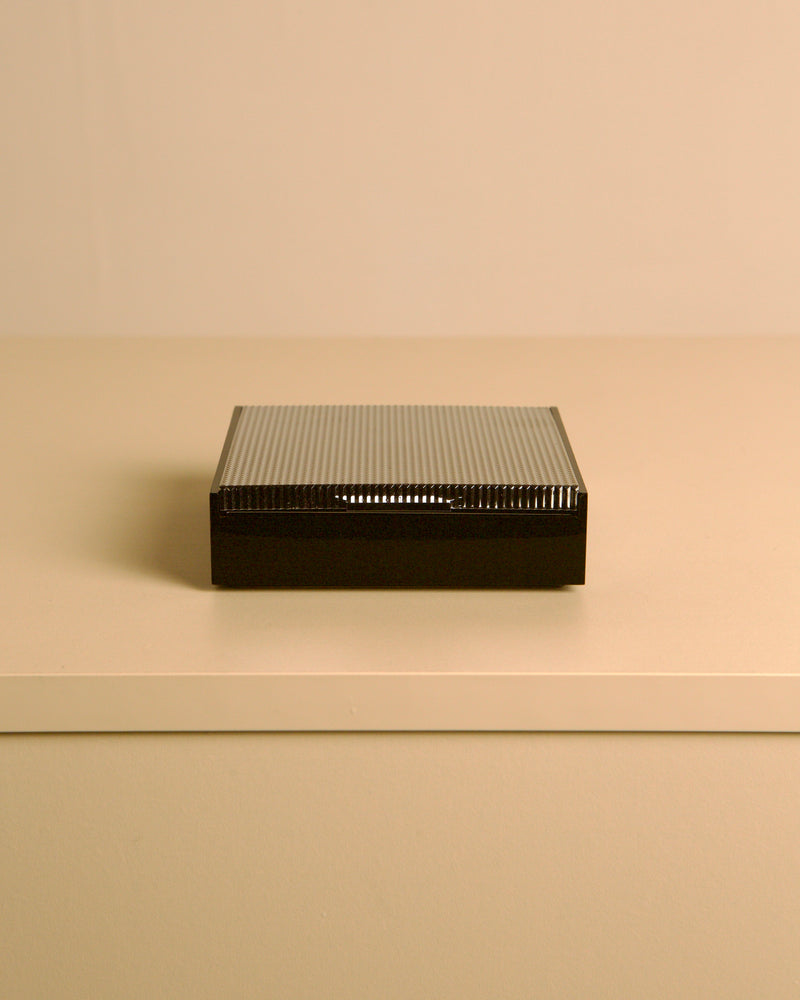 Italian box made of metal and plastic, 80s — top view on neutral surface