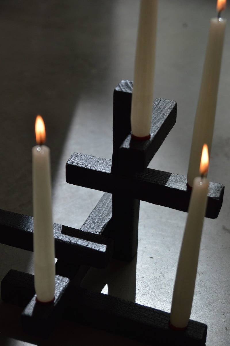TETRIS 5 — close-up of black textured candle holders with white candles