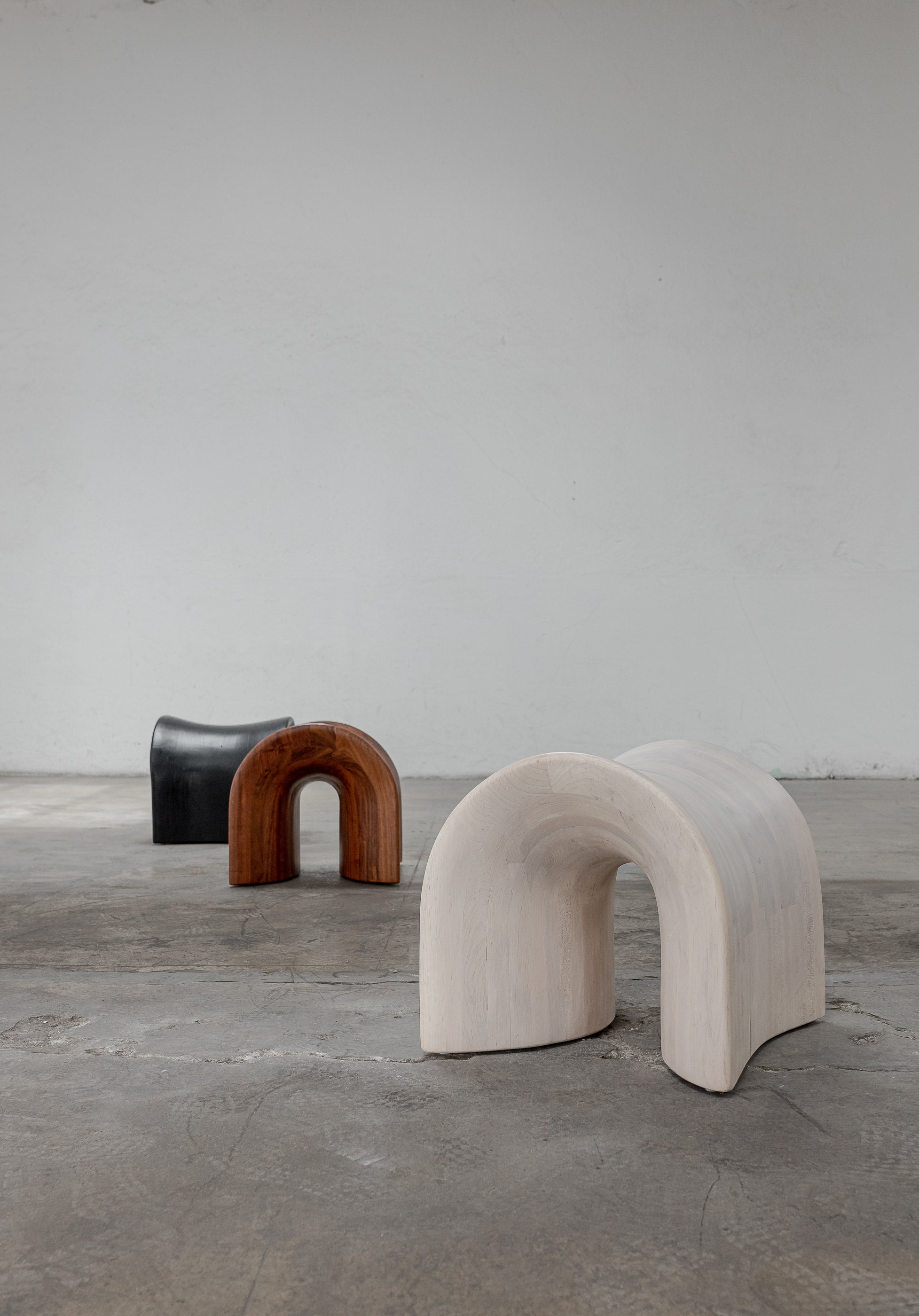 TORO Oak Stool — angled view of wooden stool in minimalist space