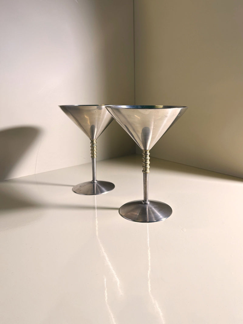 Two stainless steel martini glasses with brass twisted stems
